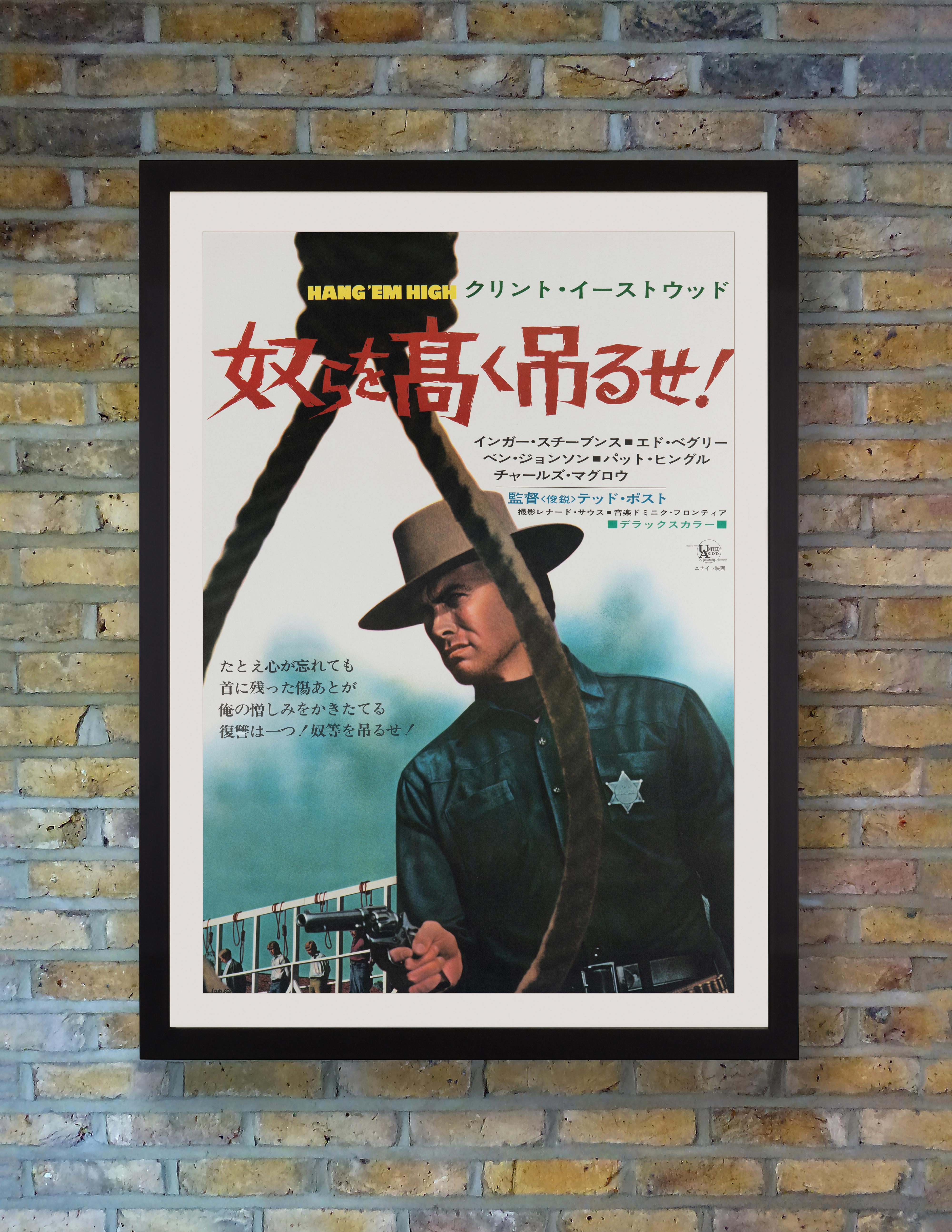 A steely Clint Eastwood dominates as a vengeful lawman fighting to bring down the vigilante lynch mob who left him for dead on this atmospheric B2 poster for the original Japanese release of Hollywood Western 'Hang 'Em High' in 1968. Eastwood's
