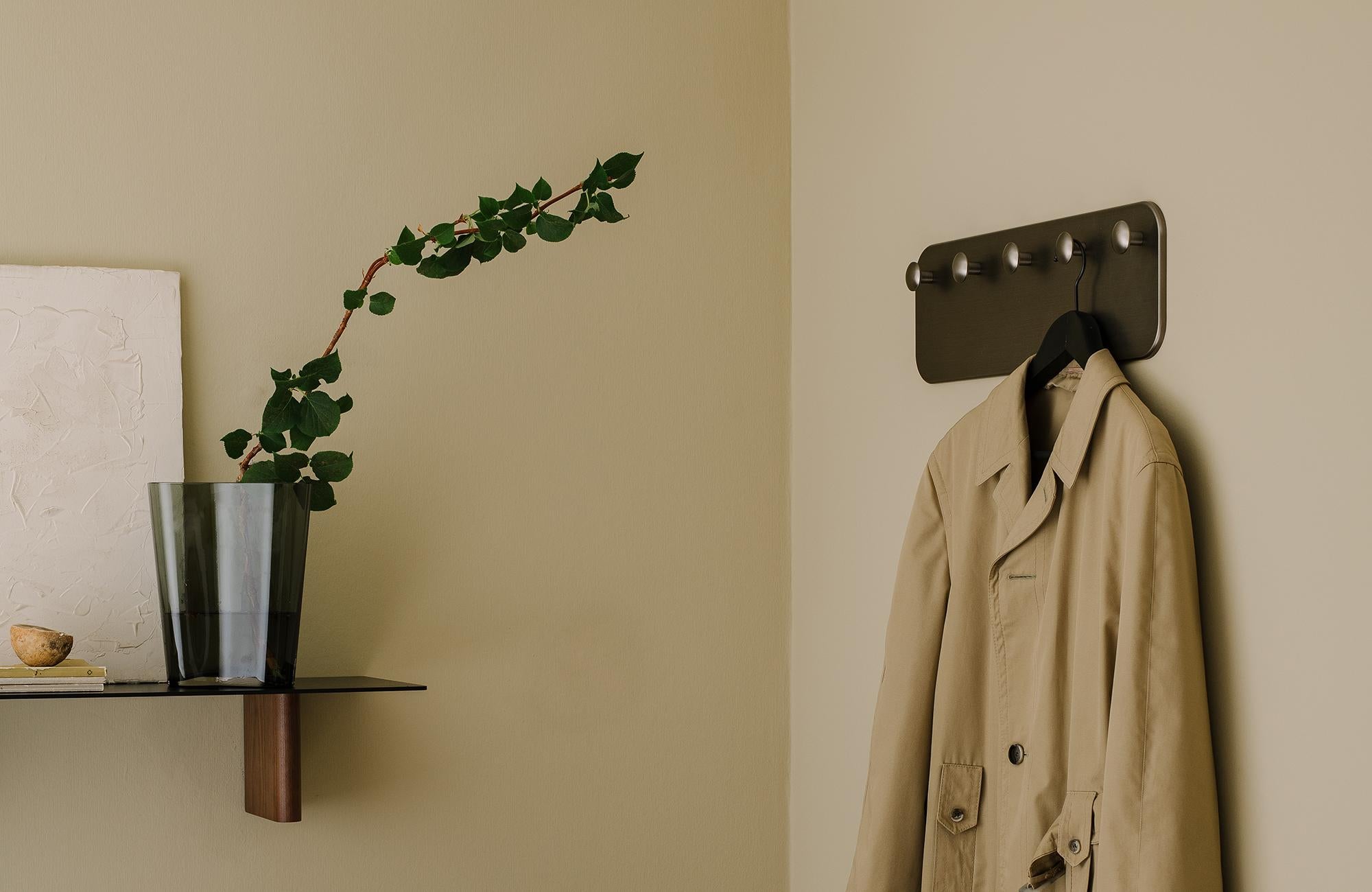 This hand-polished coat hook sits within the Collect series, a curated line of beautifully crafted soft furnishings and home objects. 
Designed by Space Copenhagen, it comes in Bronzed Brass as a row of five hangers.

Product Material
Galvanized