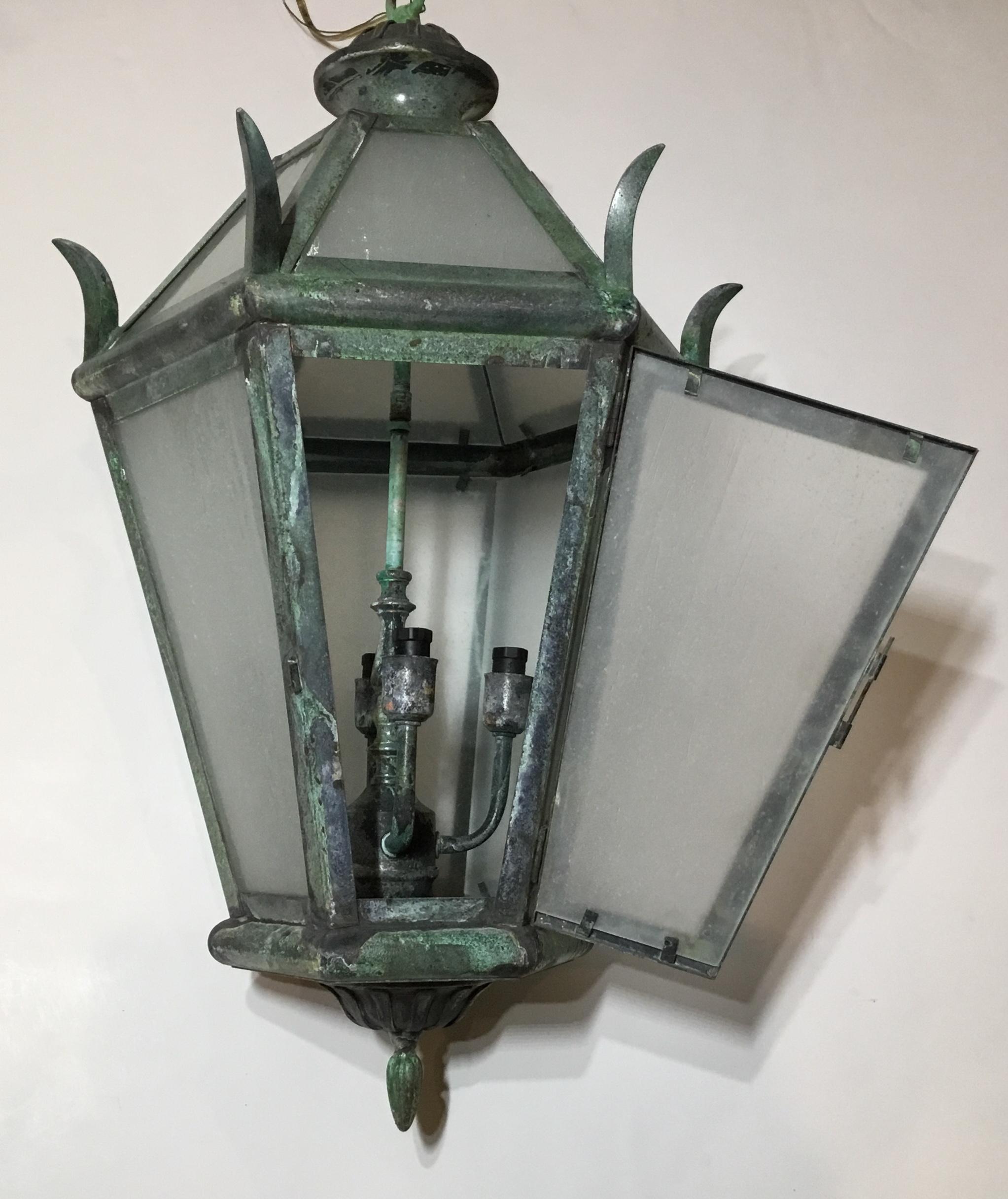 Elegant hanging lantern made of solid brass, milky color glass, with four 40/watt lights, suitable for wet locations ready to use.