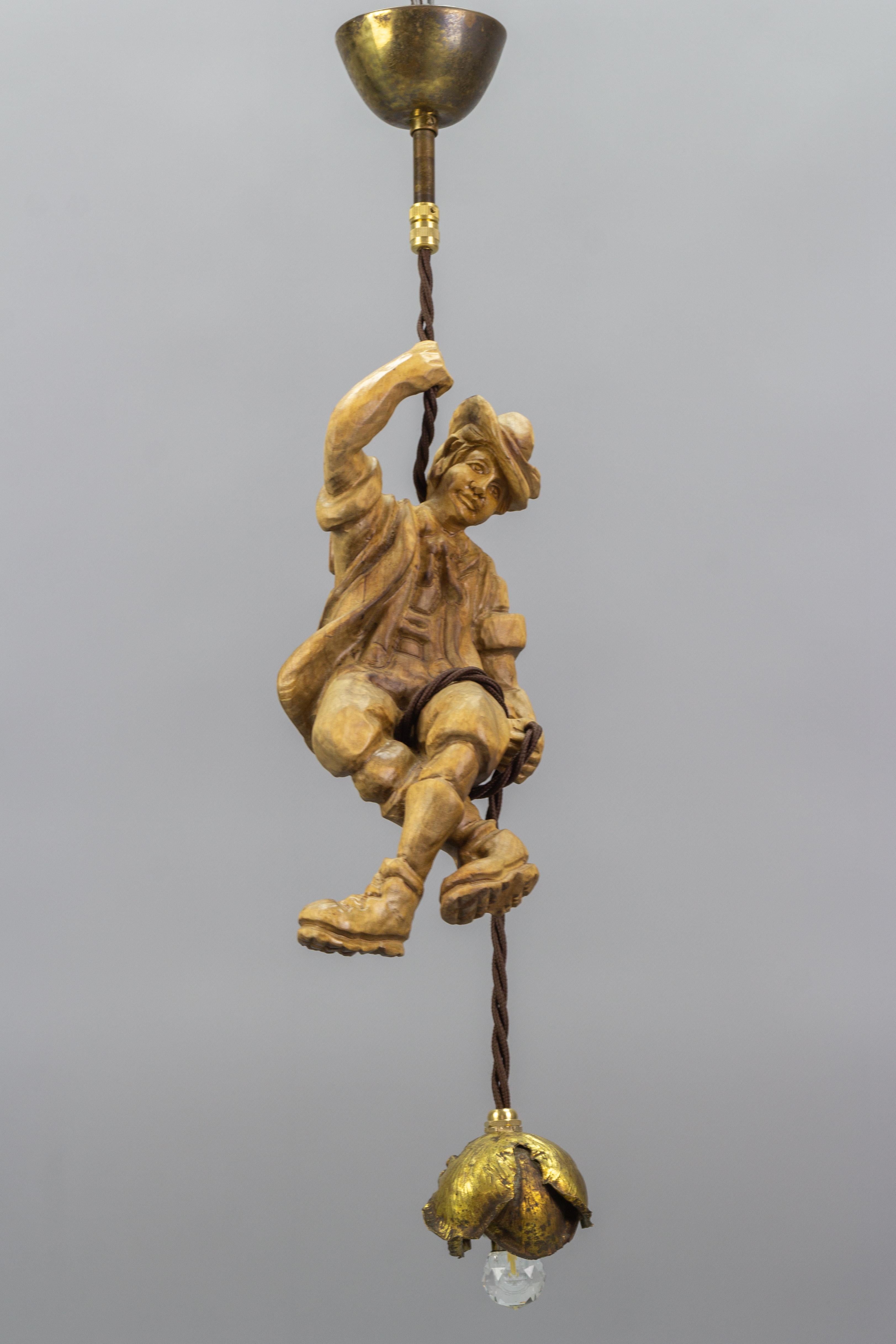 Hanging Brass Light Fixture with a Wooden Figure of a Mountain Climber For Sale 1