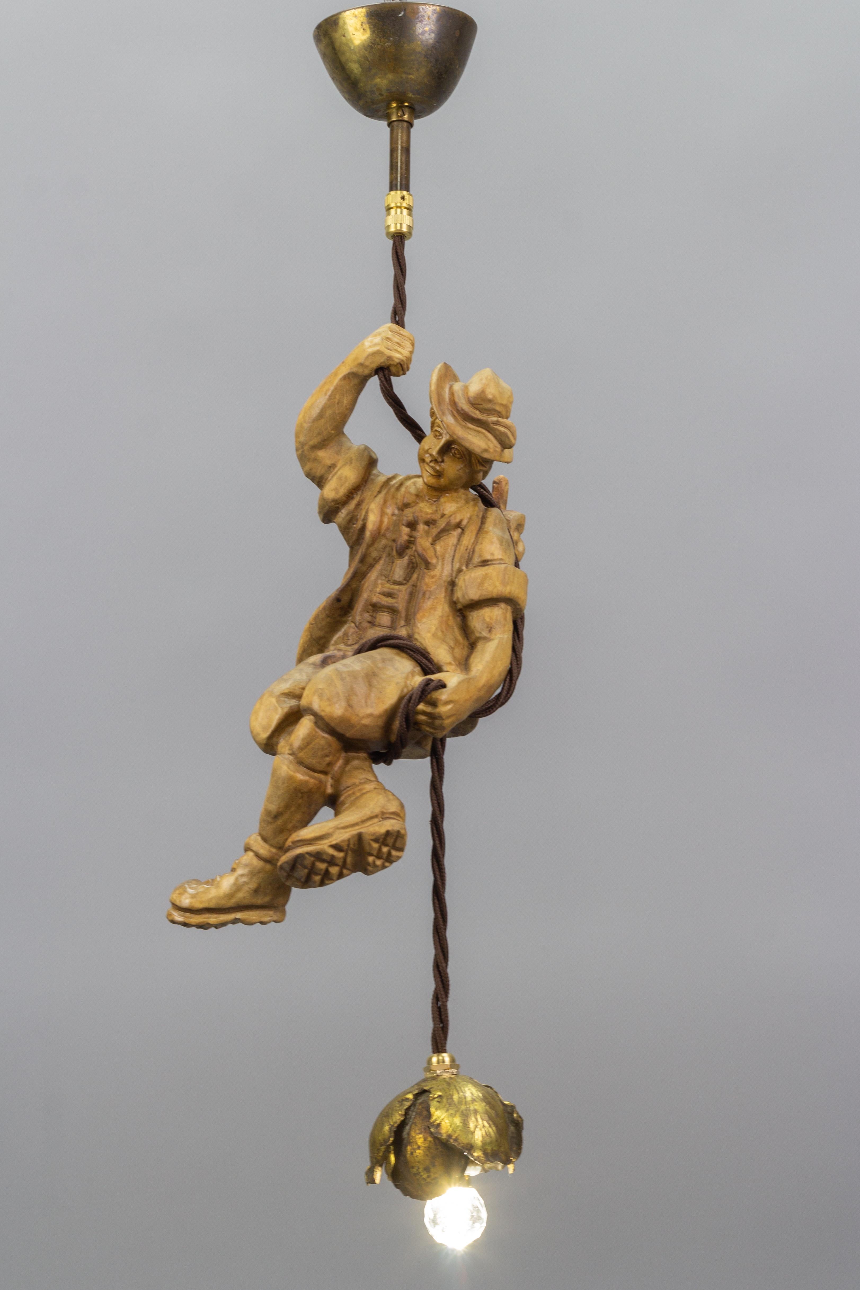 Black Forest Hanging Brass Light Fixture with a Wooden Figure of a Mountain Climber For Sale