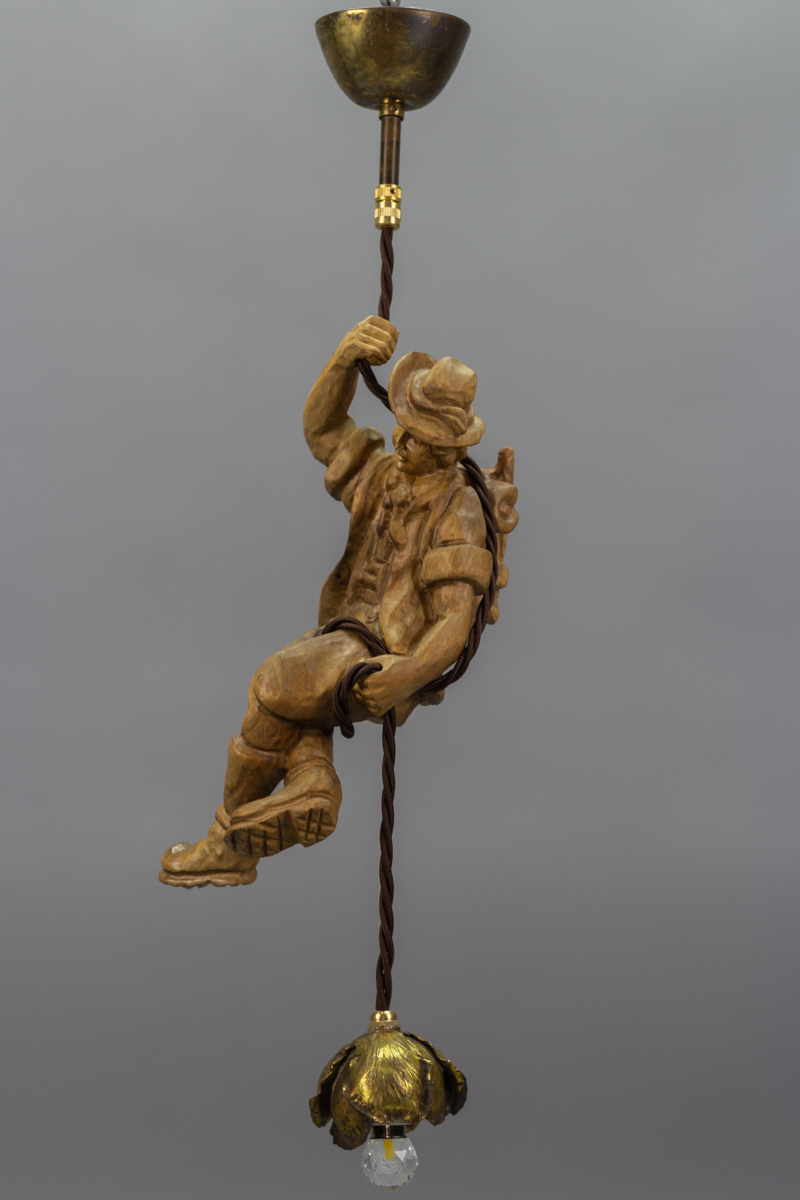 German Hanging Brass Light Fixture with a Wooden Figure of a Mountain Climber For Sale