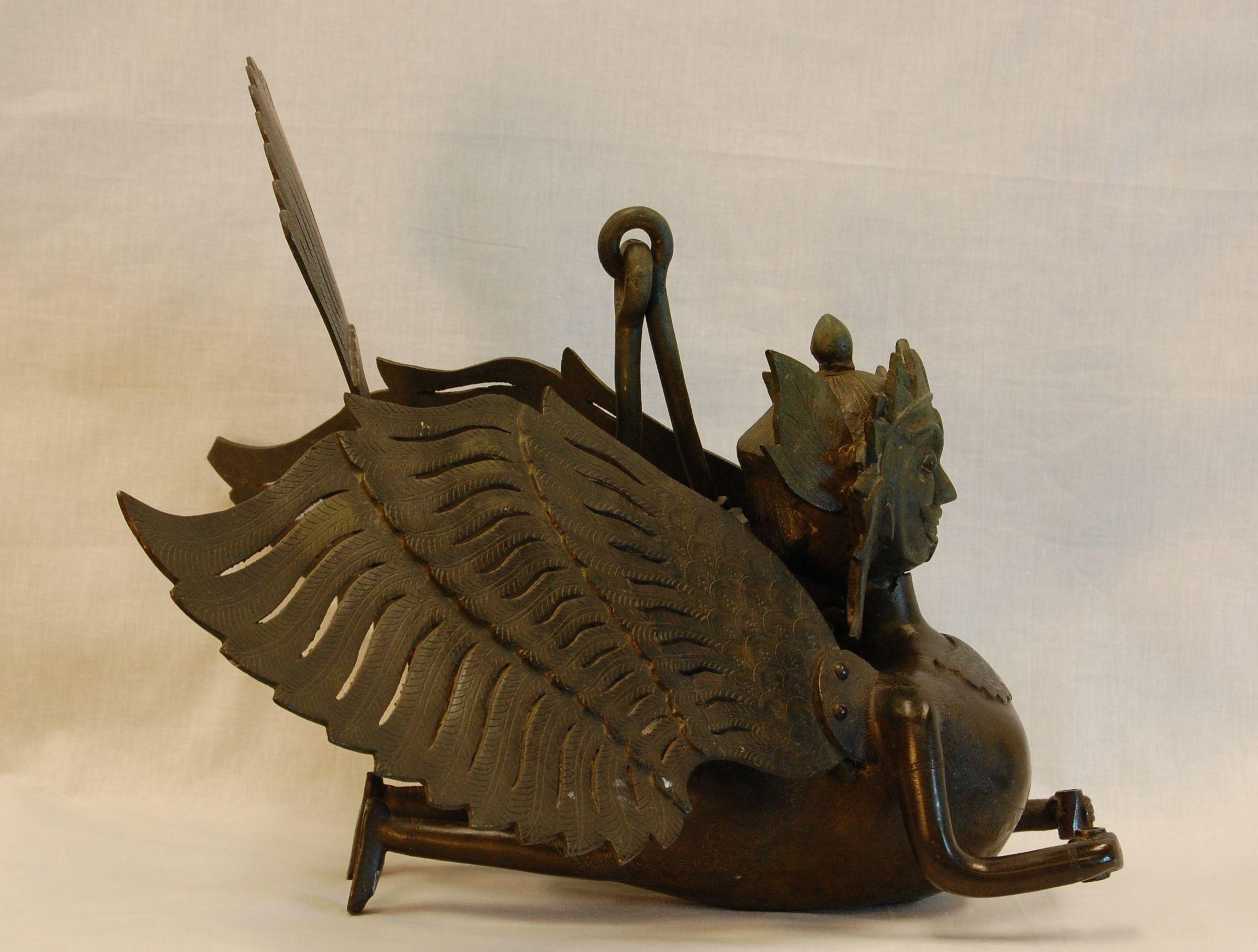 Large, heavy, hanging bronze incense burner in form of ancient Garuda figure. A very ornate and finely etched figure. Origin and exact age unknown. Purchased in 1962 from Madame Ray Paioss of Old Versaille antiques in New York City. This figure is