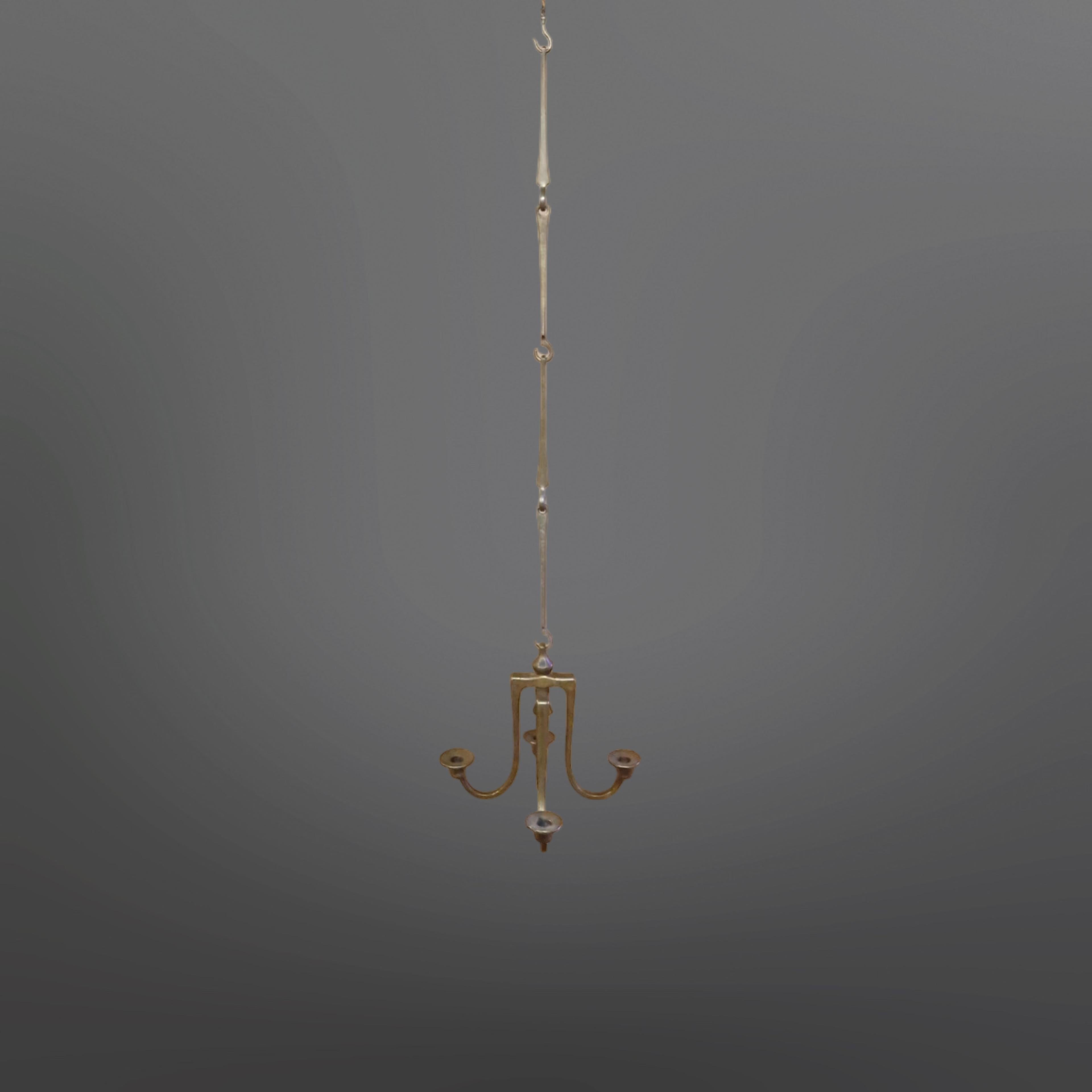 Cast bronze candelabra. It has 4 arms that are set on a central rod. The arms can rotate around the rod. At the bottom it is capped with a cast bronze cap and at the top it has a cast bronze cap with an eye. It comes with 4 cast bronze suspension