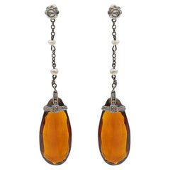Hanging earrings with citrines, diamonds and pearls.