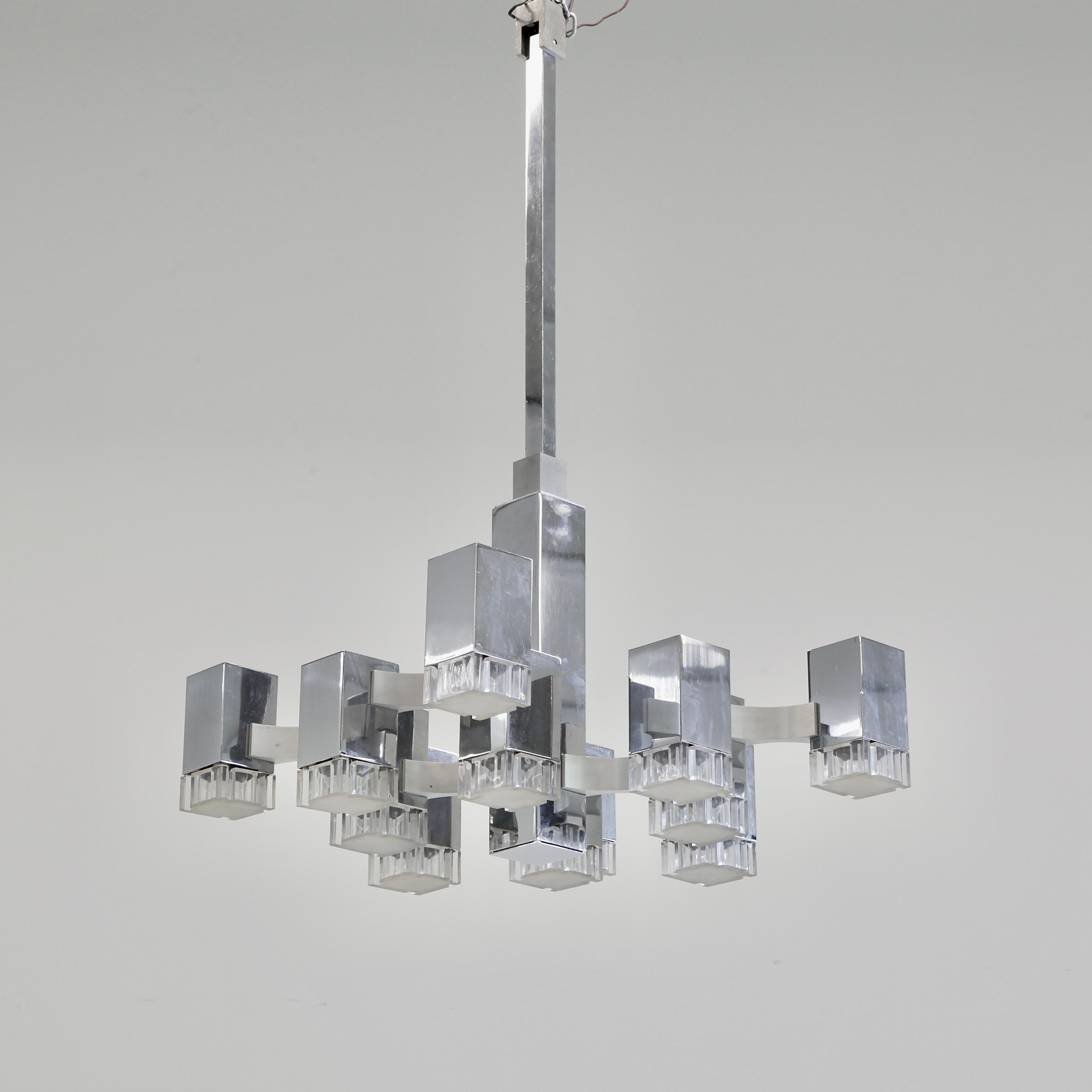 Early nickel plated ceiling light designed by Gaetano Sciolari, Italy, SCIOLARI, 1960s.

The CUBIC ceiling lamp with 12 light fittings, nickel-plated frame, plexiglass diffusers, designed and produced by Sciolari.

While the company 