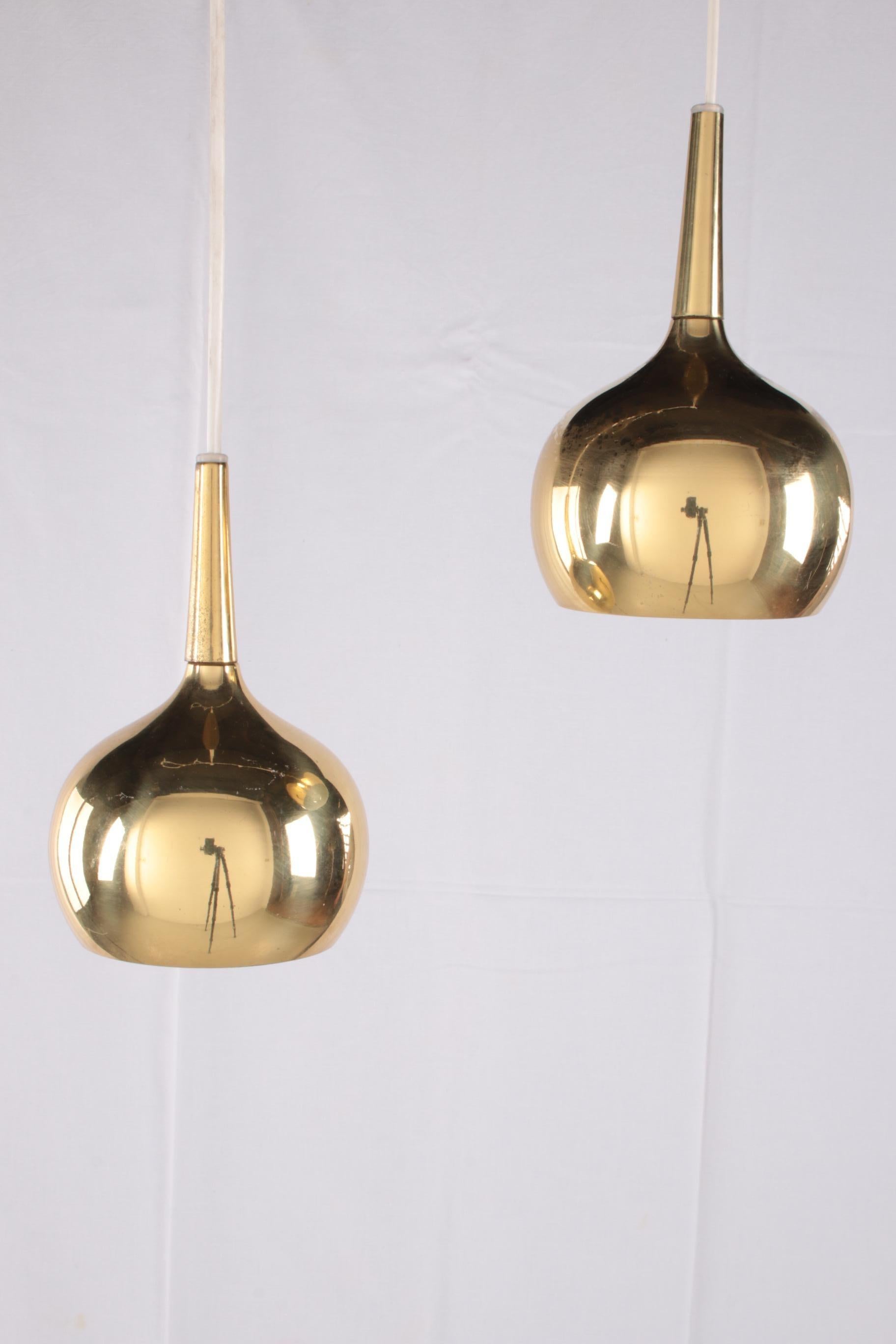 A brass pendant lamp set by the famous Swedish designer Hans-Agne Jakobsson for the lamp manufacturer Markaryd AB in the 1960s.

Hans-Agne Jakobsson was one of the most prolific lamp designers from the 1950s to the 1970s. He was one of the
