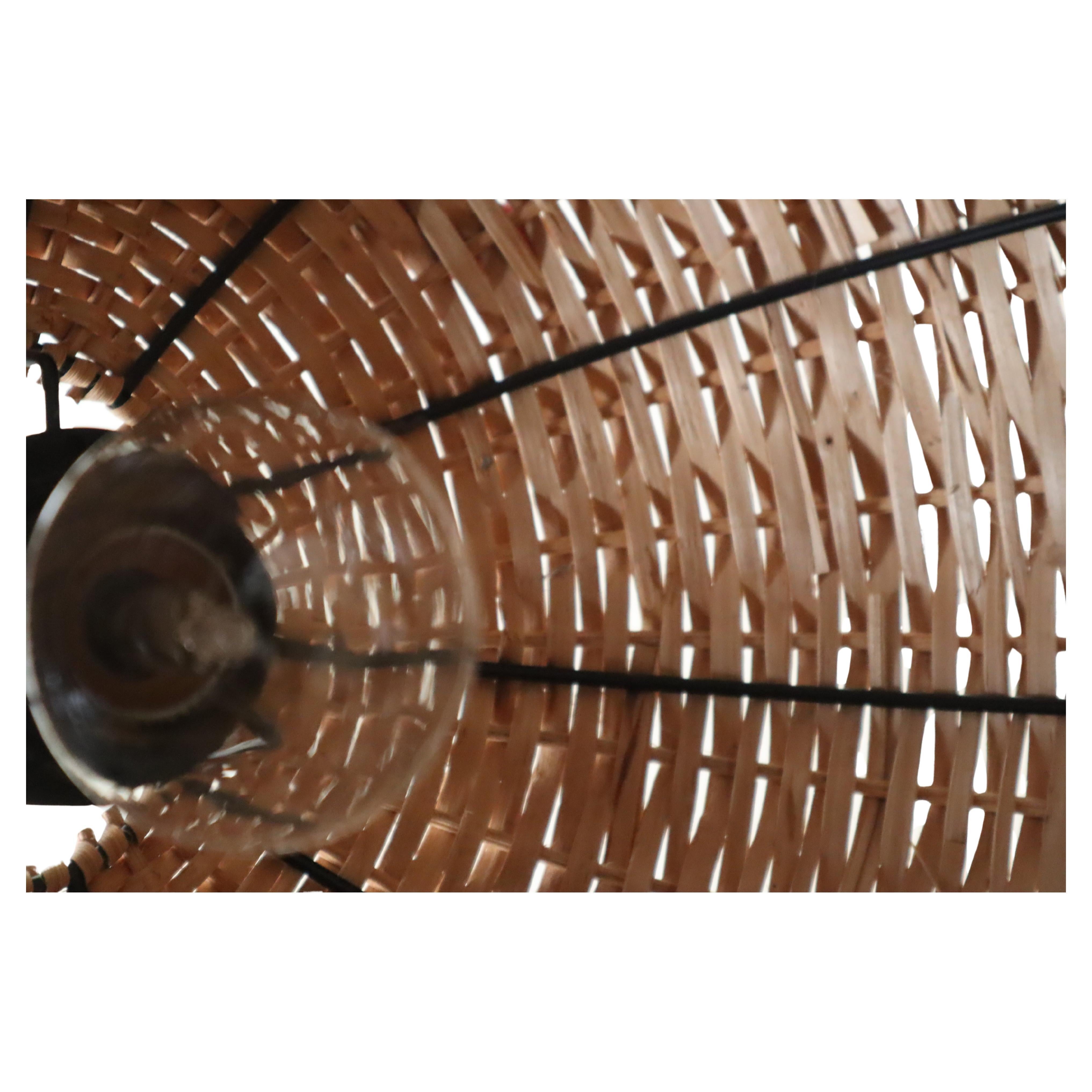 This beautiful pendant light was lovingly crafted by hand onto a steel mesh in the 1970s. The craftsmanship and the way it's aged are truly a sight to behold, especially when you compare it to modern lighting. And because it's so light, you can