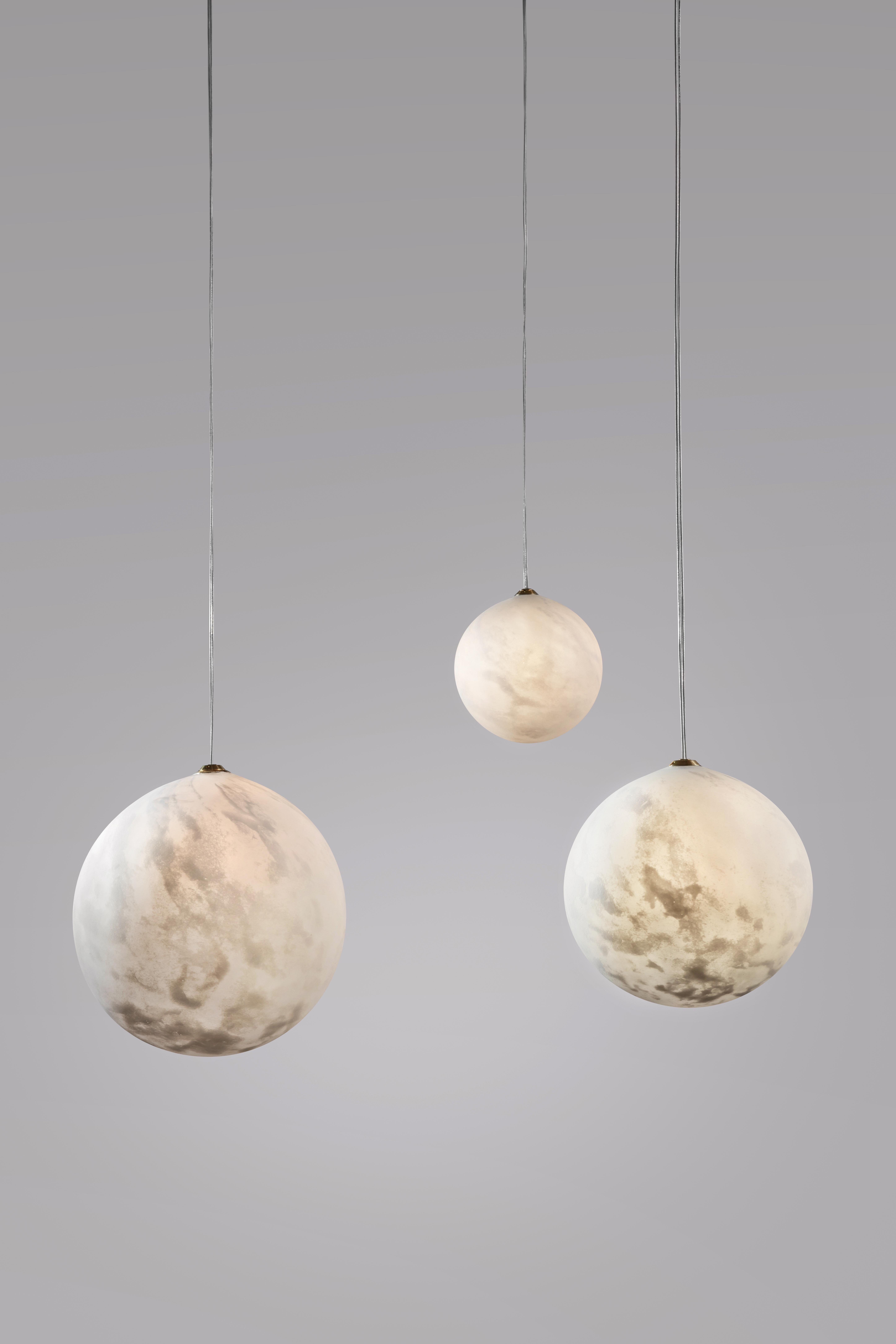 Hanging lights planets, Ludovic Clément d’Armont
Every creation of Ludovic Clément d’Armont can be made to order in any requested dimensions.
Blown glass
Dimensions of the planets can vary in the following dimensions: 10 cm, 14 cm, 18 cm, 25 cm
