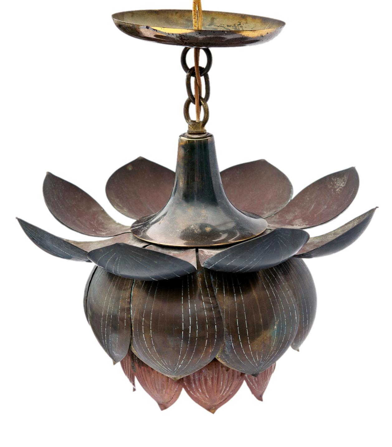 Circa 1960’s Italian lotus flower repoussé brass light fixture with one interior light. The fixture features a brass lotus flower hanging from a short chain the original canopy & chain in polished brass are included.  A striking piece with pretty