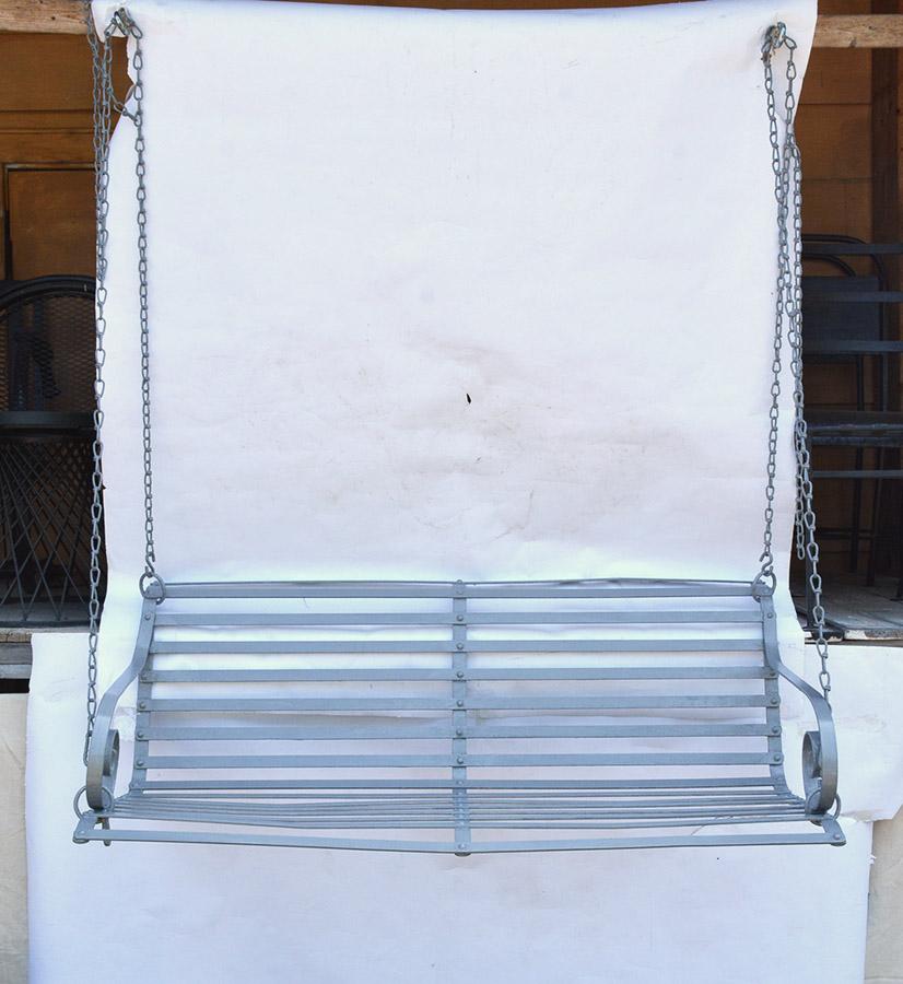 Vintage two-seat garden loveseat swing painted for outdoor use. A wonderful addition to any garden or porch.