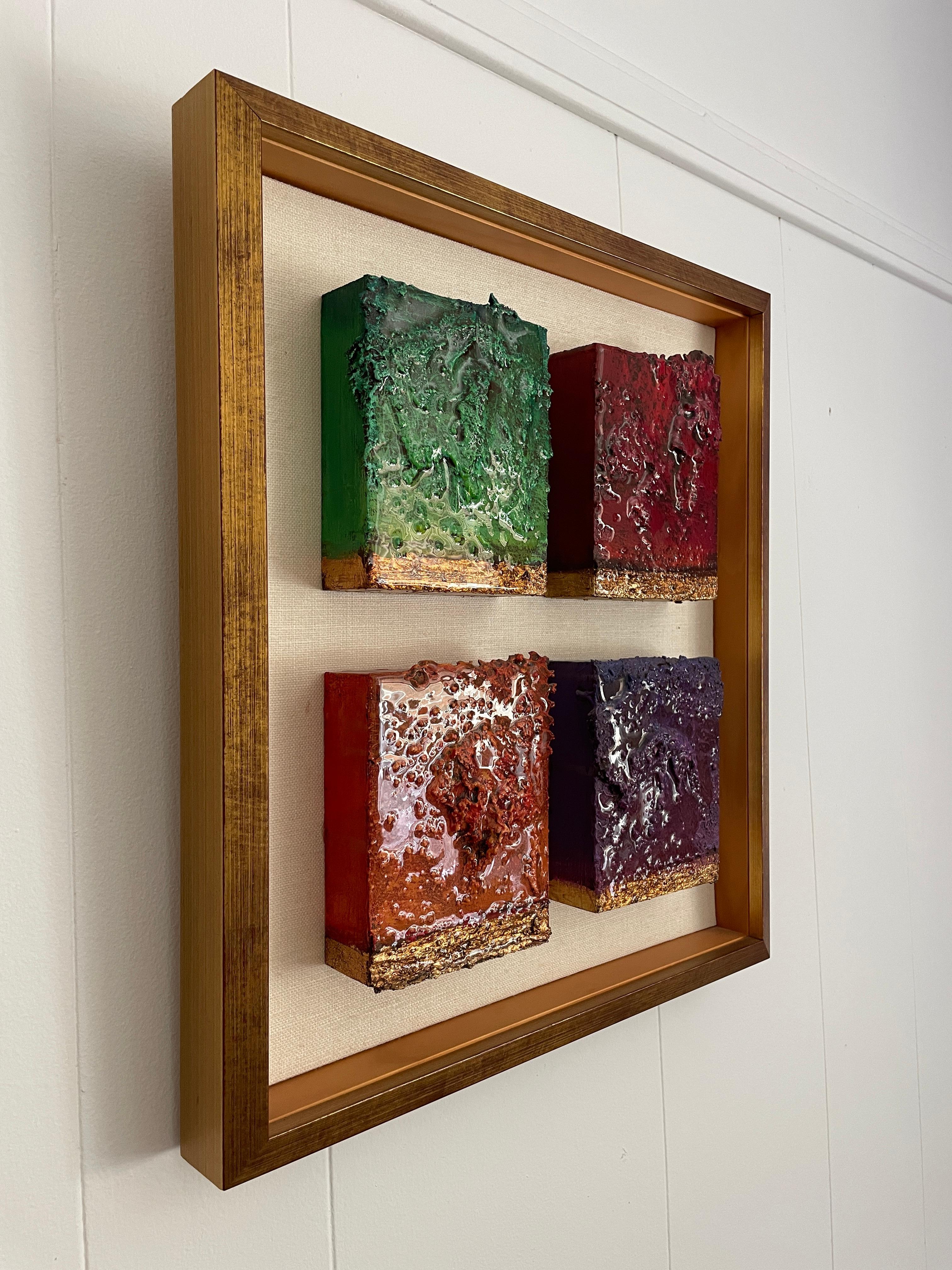 Stunning wall sculpture by Sylvia Moss. It contains four 3D resin-covered cubes in different colors. 

Sylvia (1935-May 9, 2011) was born into an artistic family and began painting and drawing in her teens. She attended many schools and classes: