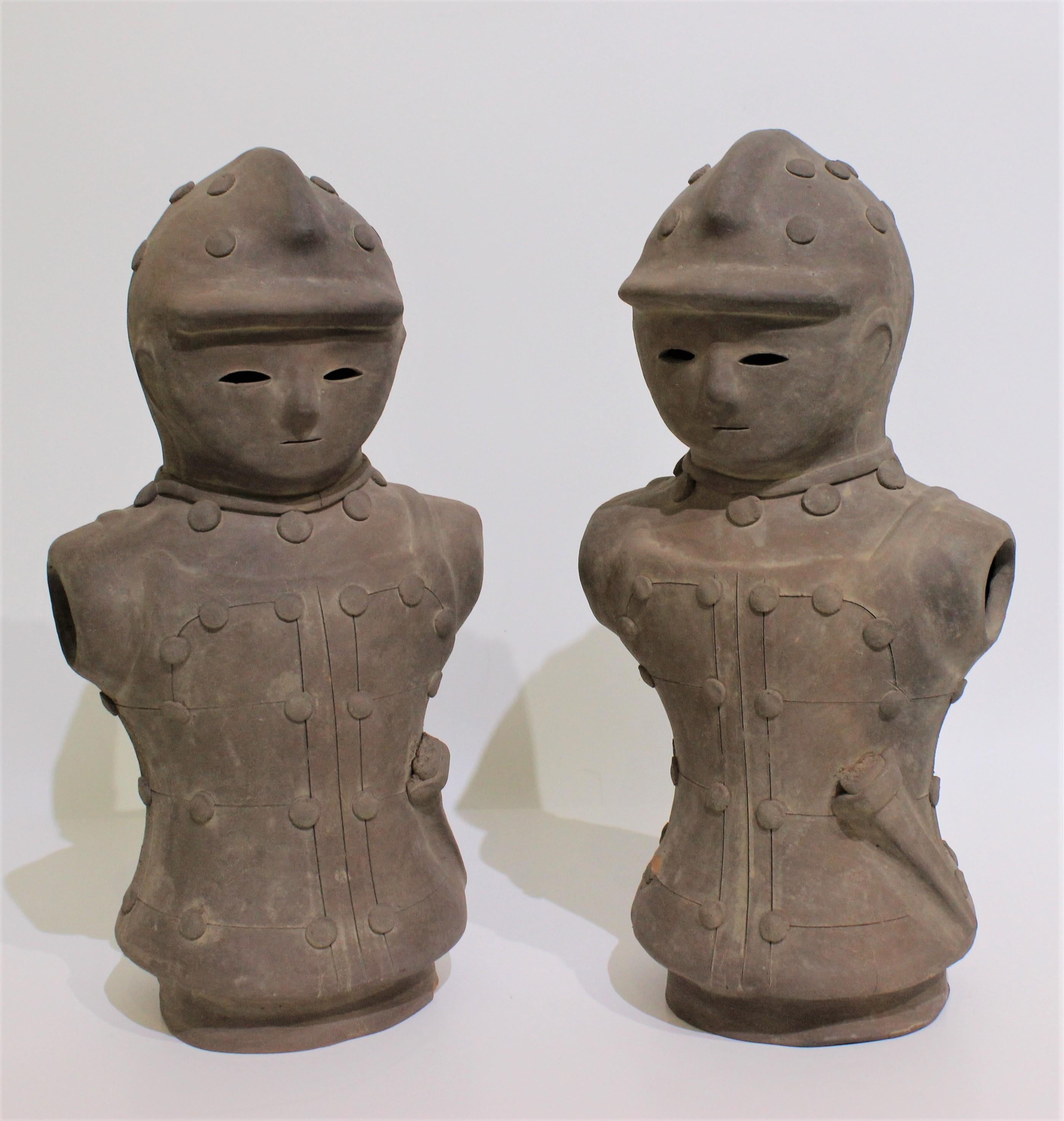 Vintage Haniwa Style Figures Unglazed Terra Cotta Japan - a set of two - from a Palm Beach estate

There is a small chip on the base of one and a chip on the button of the other. See photos.

Both are 15 3/4