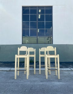 Hank Lowenstein's Oggo Pavoda barstools in warm-white wood with rush seats