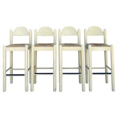 Hank Lowenstein's Oggo Pavoda barstools in warm-white wood with rush seats
