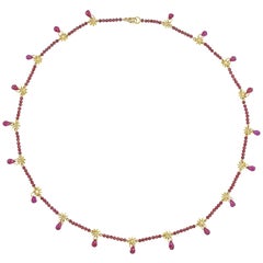 Hanmade Gold and Garnet Necklace by Lucie Heskett-Brem