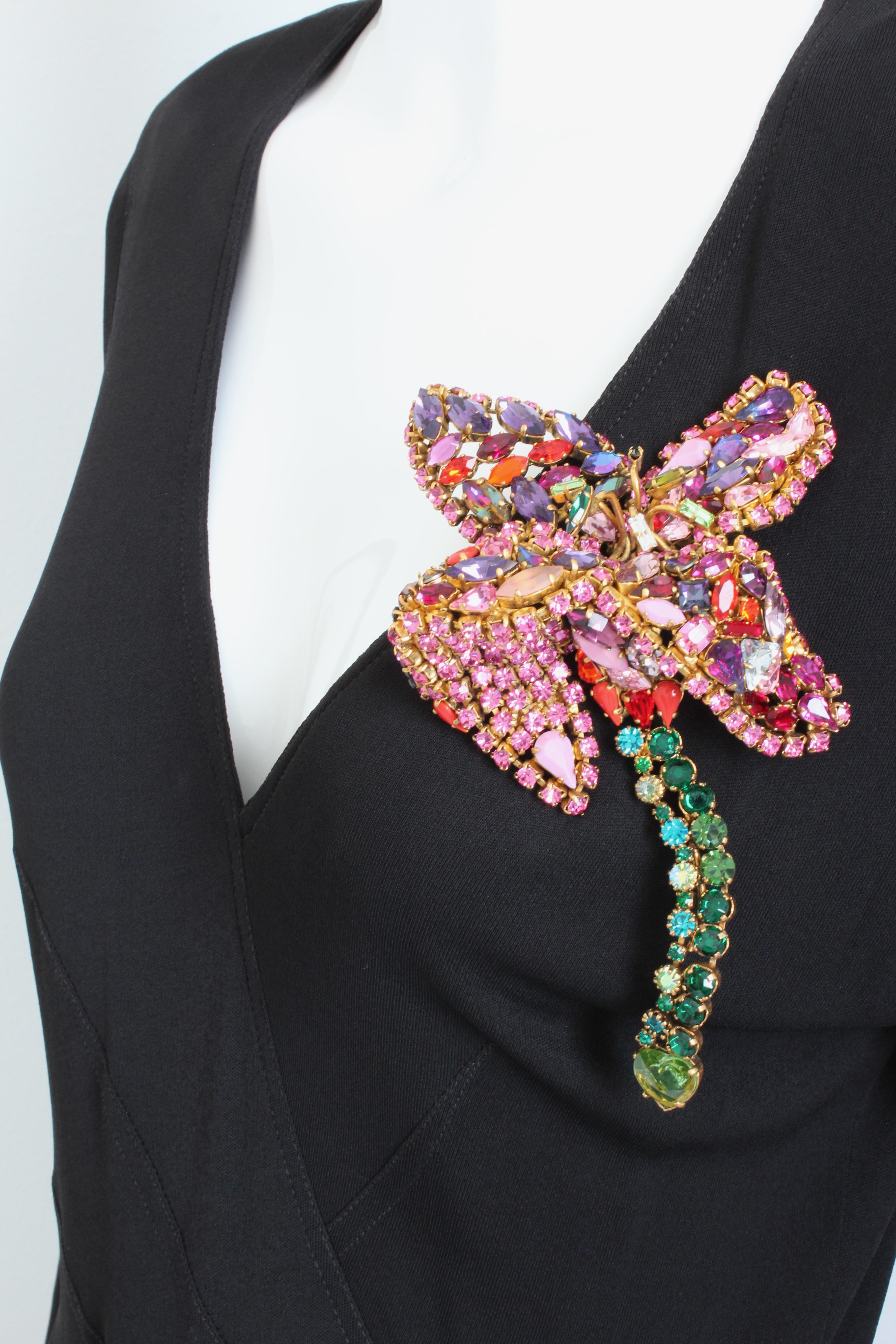 Like making a statement? This one-of-a-kind floral brooch was created by Hanna Bernhard Paris and features an array of colorful crystals and gemstones, handset on a gold-fired copper setting. This piece features articulated components on the stem