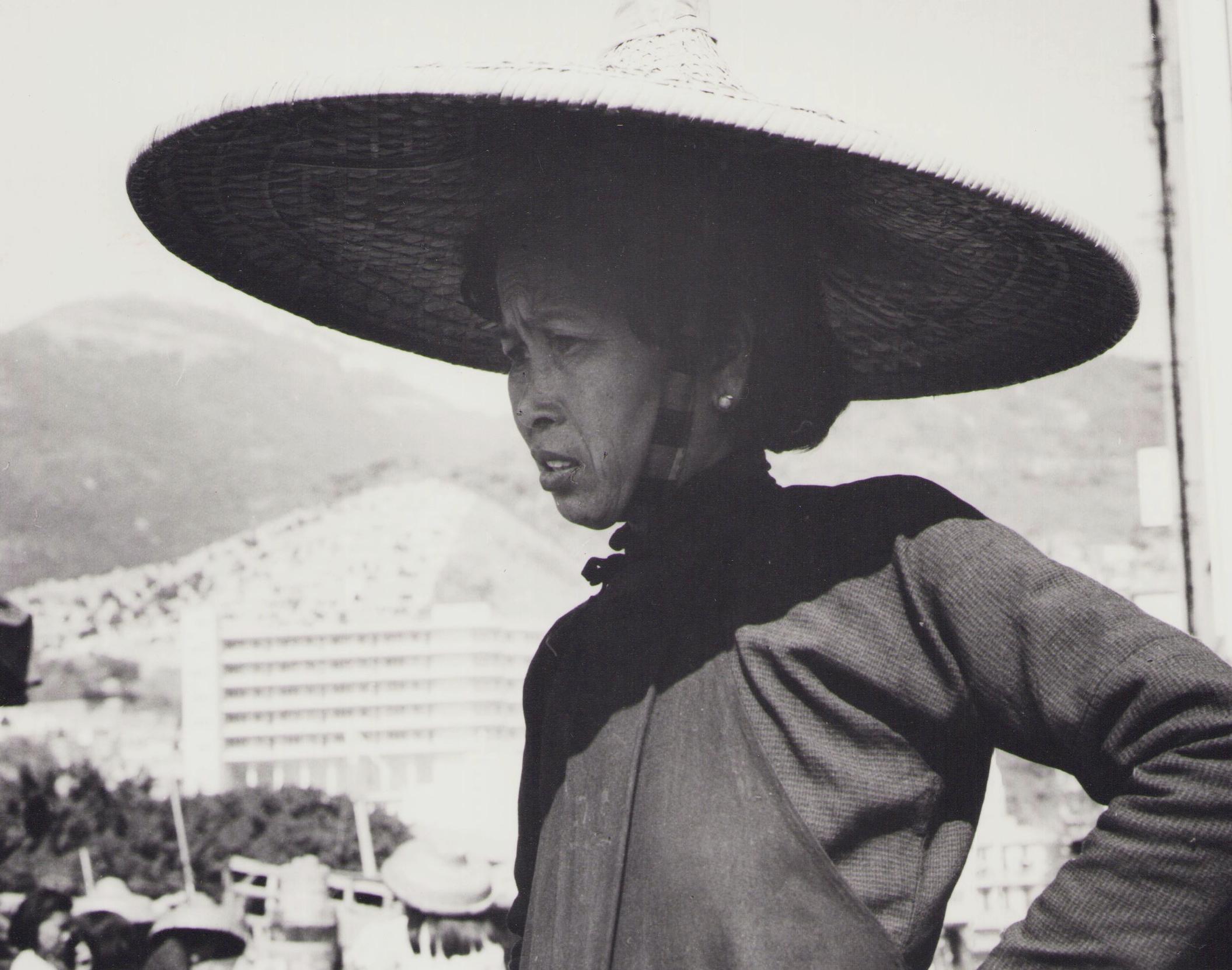 Hong Kong, Woman, Street, Black and White Photography, 1960s, 24 x 24 cm - Gray Portrait Photograph by Hanna Seidel