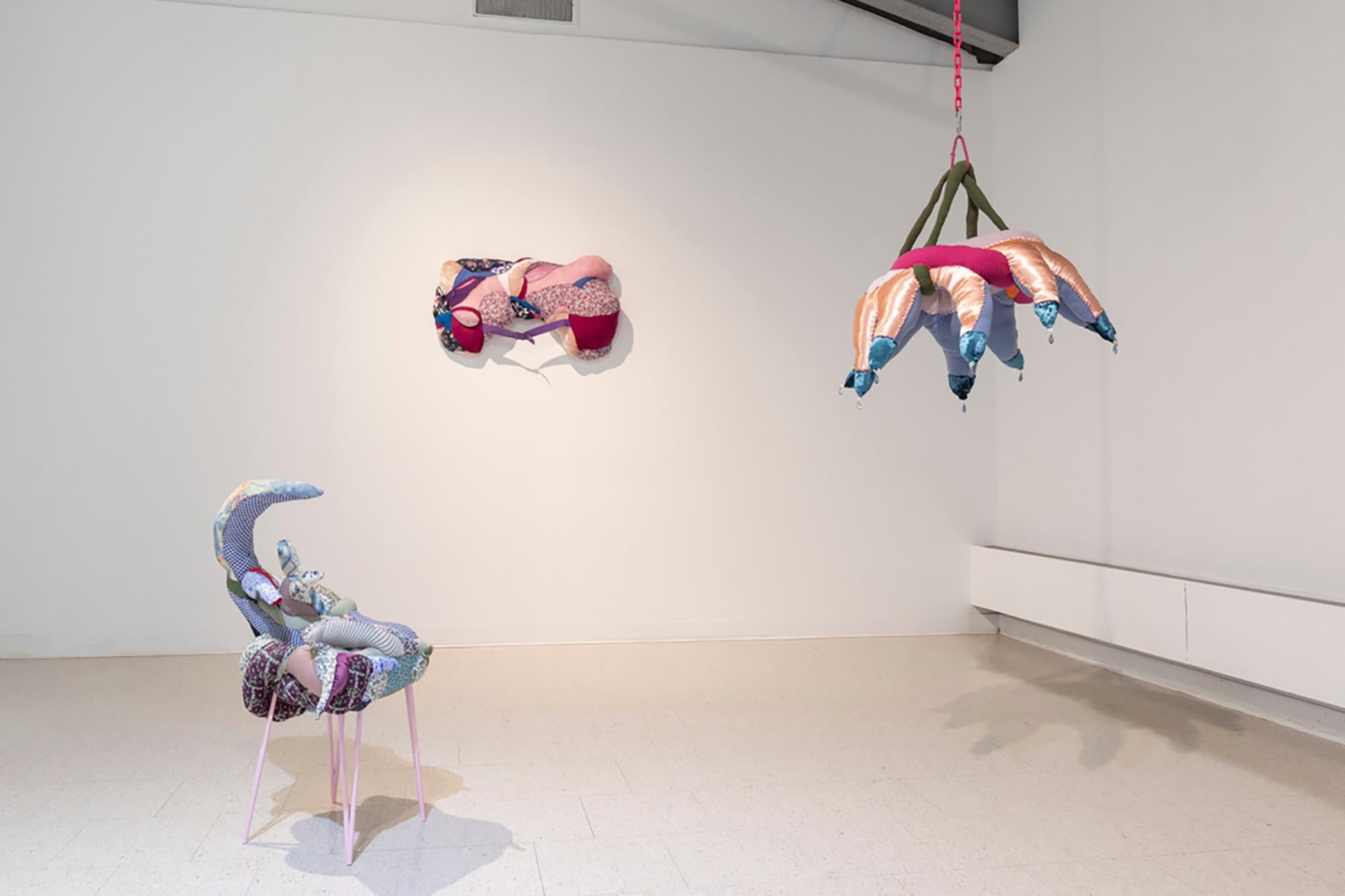 Recycled textiles, thread, batting, glazed ceramic, metal table, spray paint
34 x 22 x 18 inches

Artist Statement
I hand-sew compound sculptural forms that are constructed from clothing, furniture, household items, and other utilitarian materials.