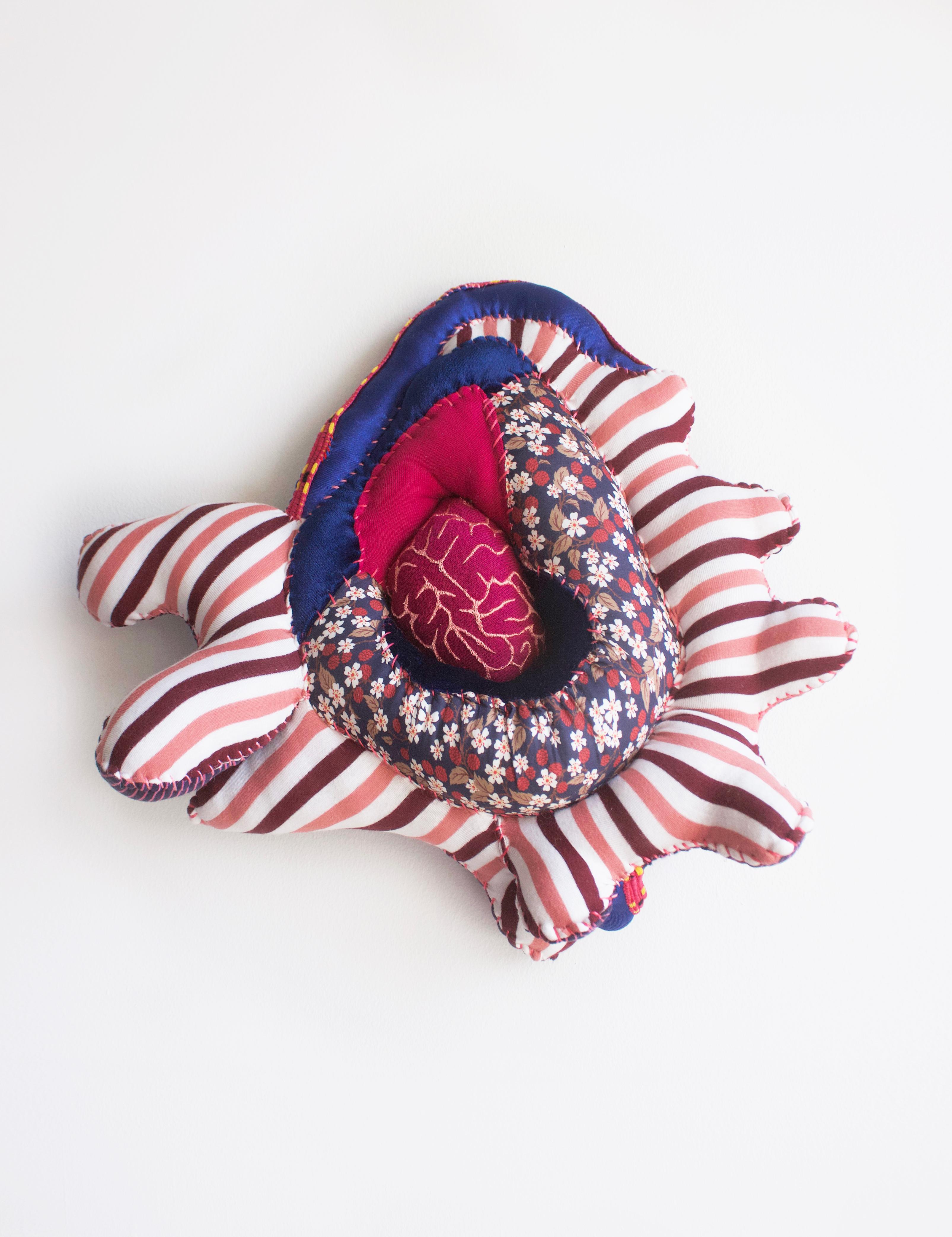 Hanna Washburn Abstract Sculpture - Soft Spot, textile, patterned, pink, red, blue, organic, soft sculpture
