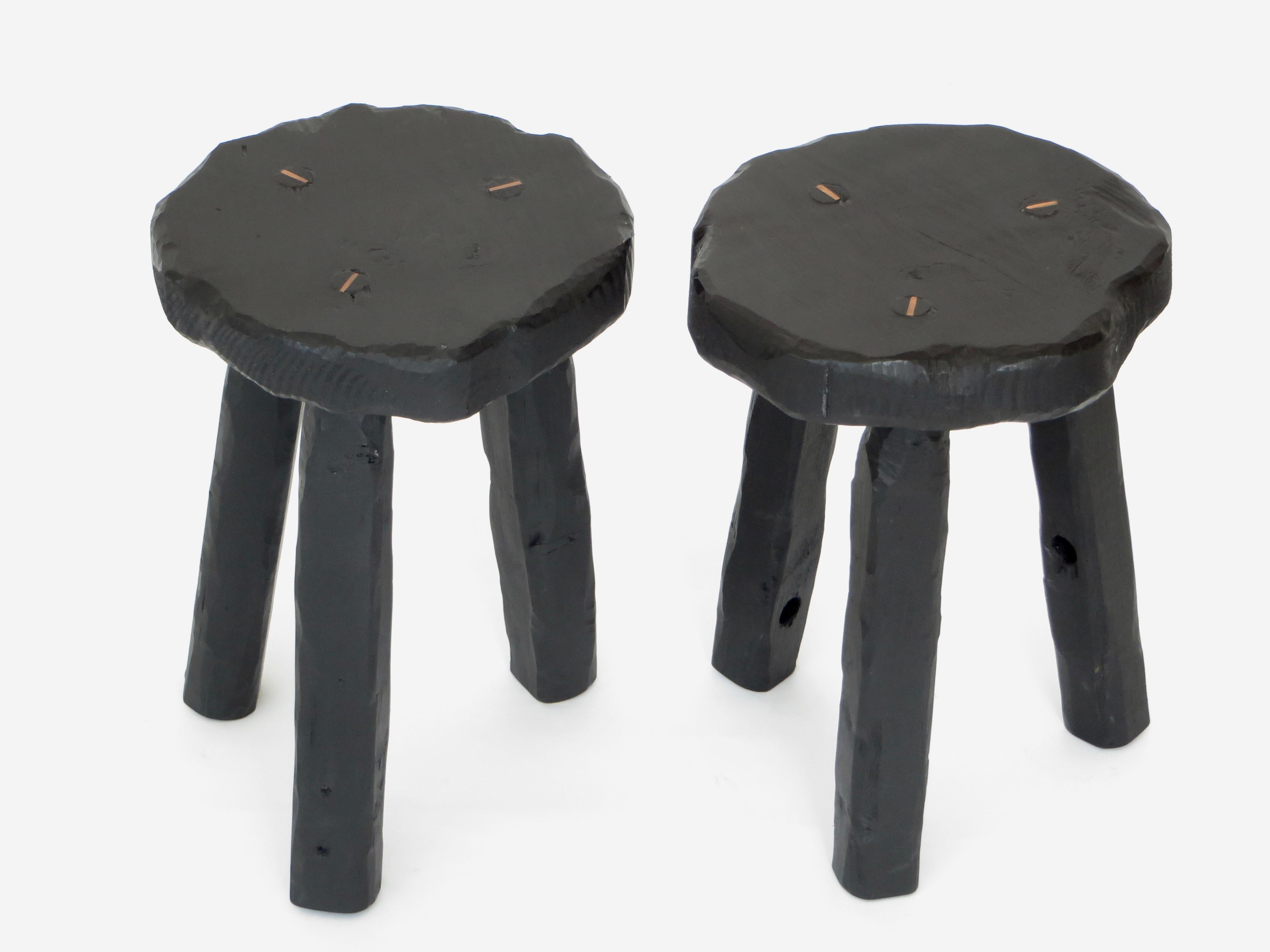 Artist Hannah Vaughan hand carved anthropological salvage collection stools. 
Carved of recovered wood and painted with black acrylic and organic beeswax.
Created in 2017. Special order. 