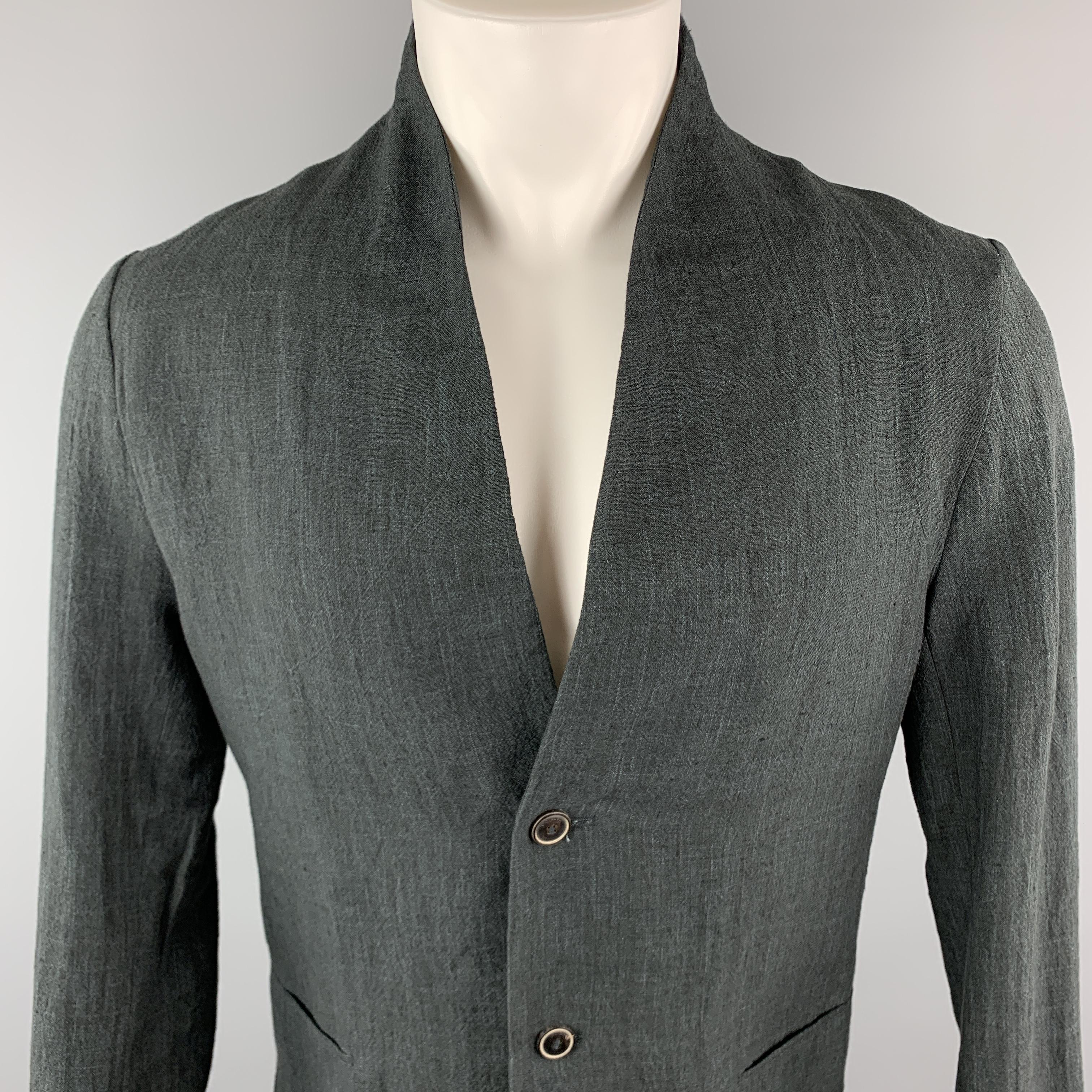 HANNIBAL Jacket comes in a charcoal tone in a solid linen material, with a shawl collar, slit pockets, 2 buttons at closure, single breasted, a single button at cuff, internal pockets and a single vent at back. Made in Germany.

Excellent Pre-Owned