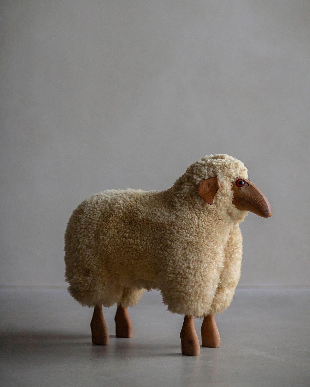 The Hanns-Peter Krafft Wool Sheep Sculpture, an early edition with plenty of vintage charm, was crafted for the German Company Meier. Handmade, this sculpture showcases unique character and attention to detail.

Constructed primarily from beech