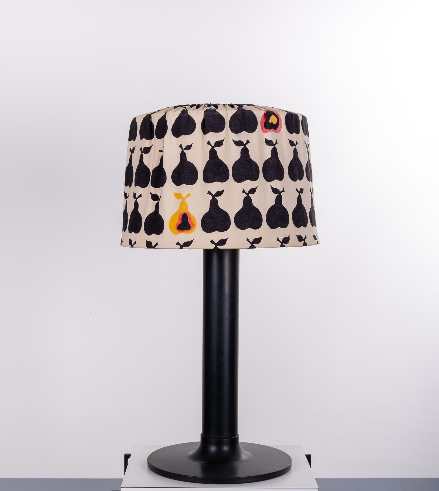 Still together this lovely aluminum Tulip shaped lamp base, and his original fabric shade. Decorated with pears. Very rare set.
In black yellow and pink. So stylish. Both signed, with the great Swedish designer Hans-Agne Jacobsson
No discoloration