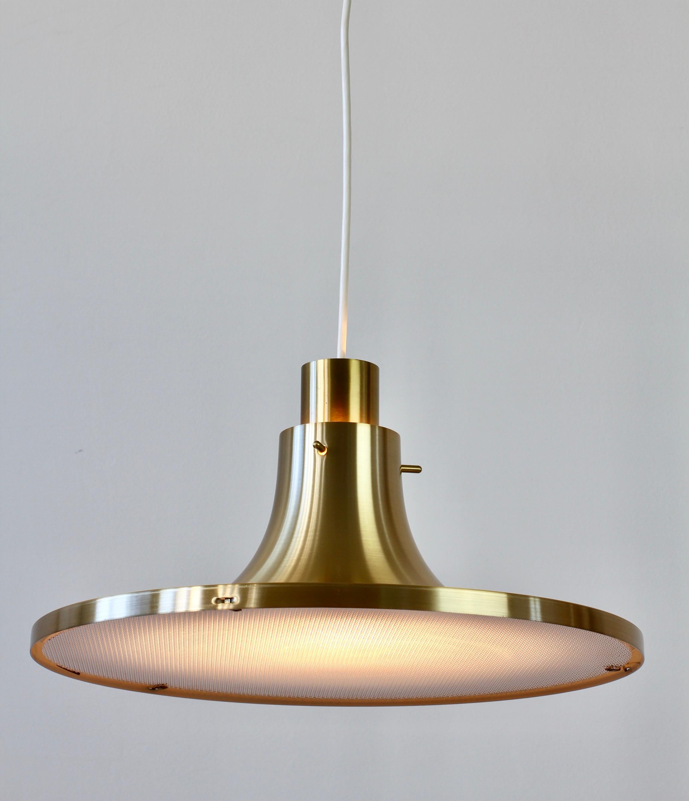 'New Old Stock' Scandinavian Modern hanging pendant ceiling light / lamp designed by Hans-Agne Jakobssen for AB Markaryd of Sweden with original packaging. Extremely rare to find in this condition and in the full 'brass' 'gold' colored finish.