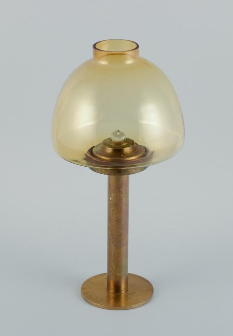 Hans-Agne Jakobsson (1919-2009), candlestick in brass and smoked glass.
Approx. 1970s.
In excellent condition with fine patina.
Dimensions: H 35.5 x D 16.5 cm.