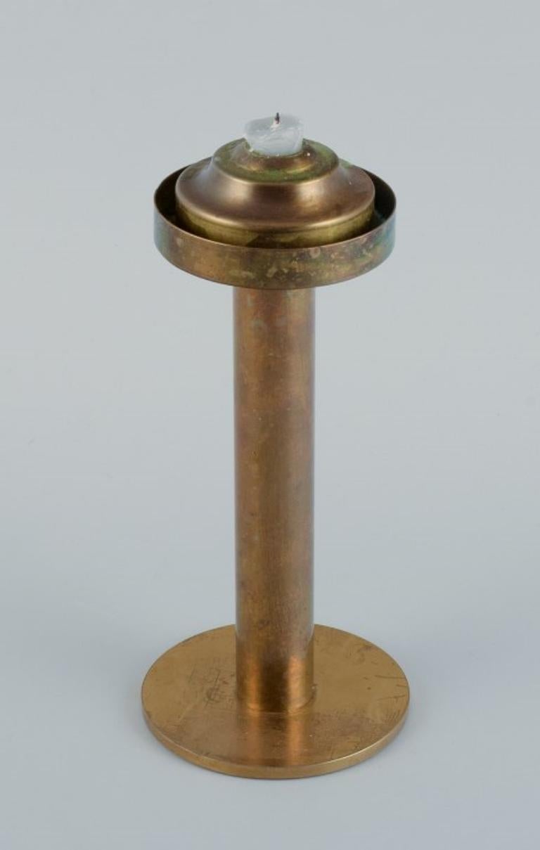 Brass Hans-Agne Jakobsson (1919-2009), candlestick in brass and smoked glass.