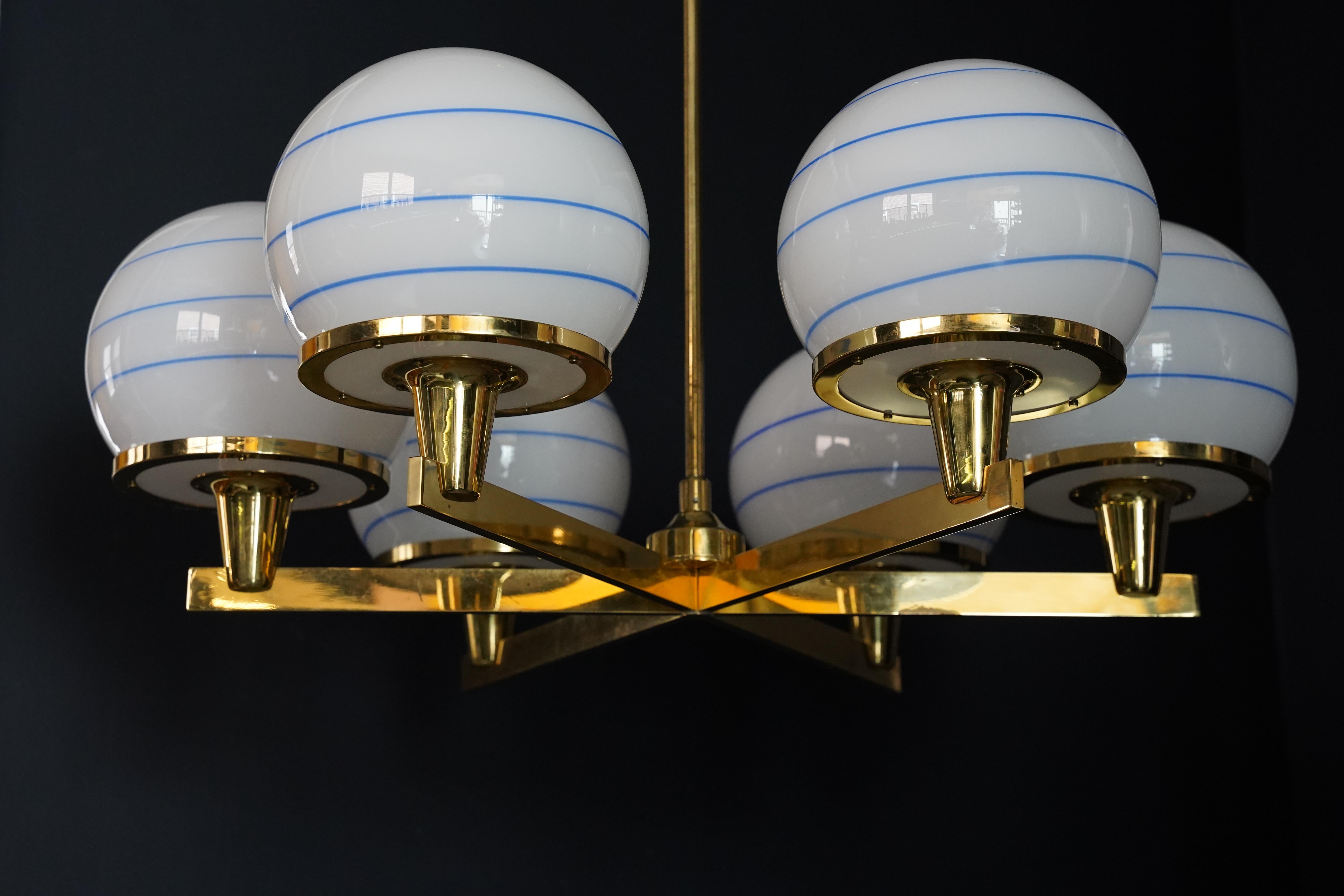 Cast Hans-Agne Jakobsson 6 arm brass chandelier, glass shades white ball, 1960 Sweden For Sale