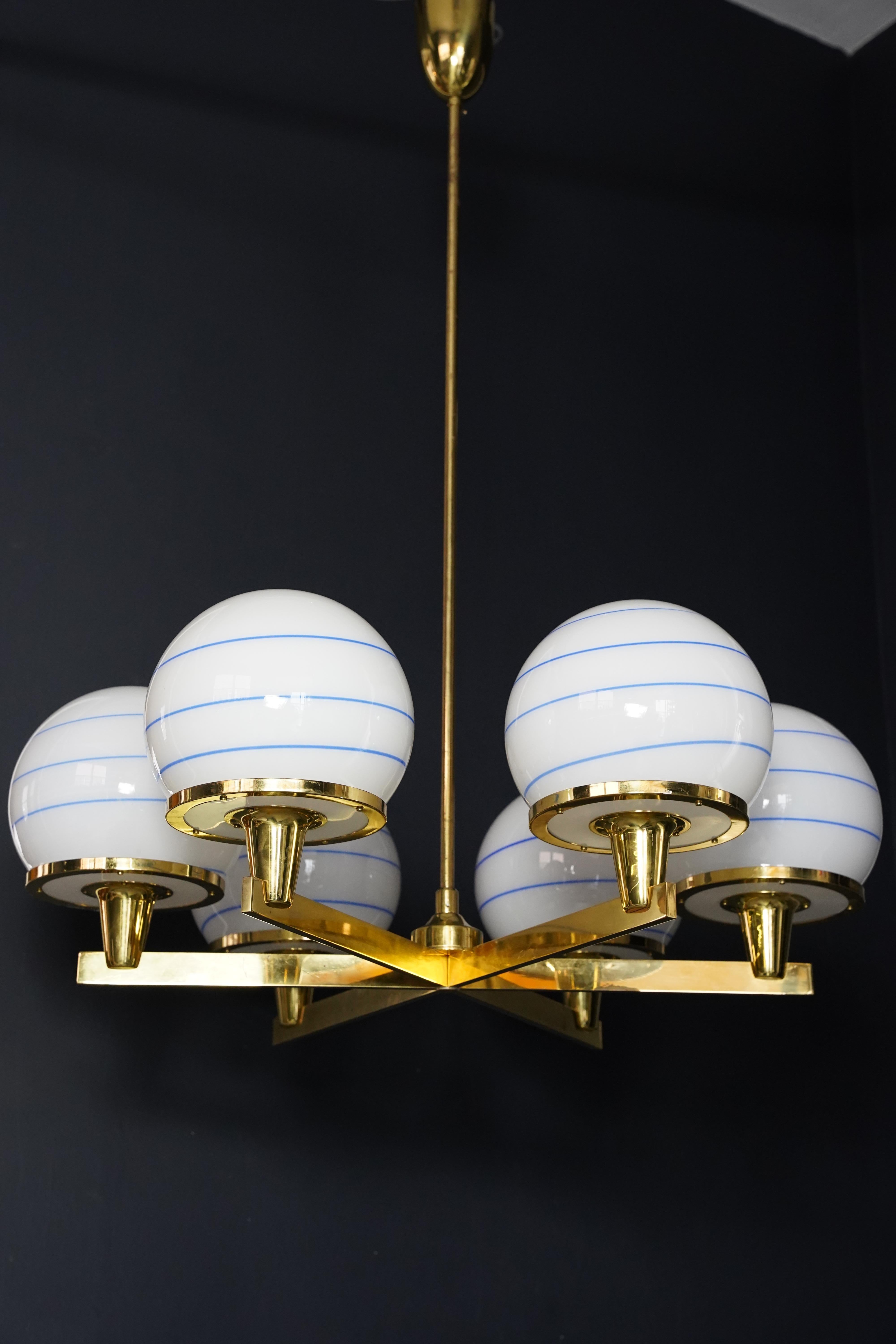 Hans-Agne Jakobsson 6 arm brass chandelier, glass shades white ball, 1960 Sweden In Good Condition For Sale In Bronx, NY
