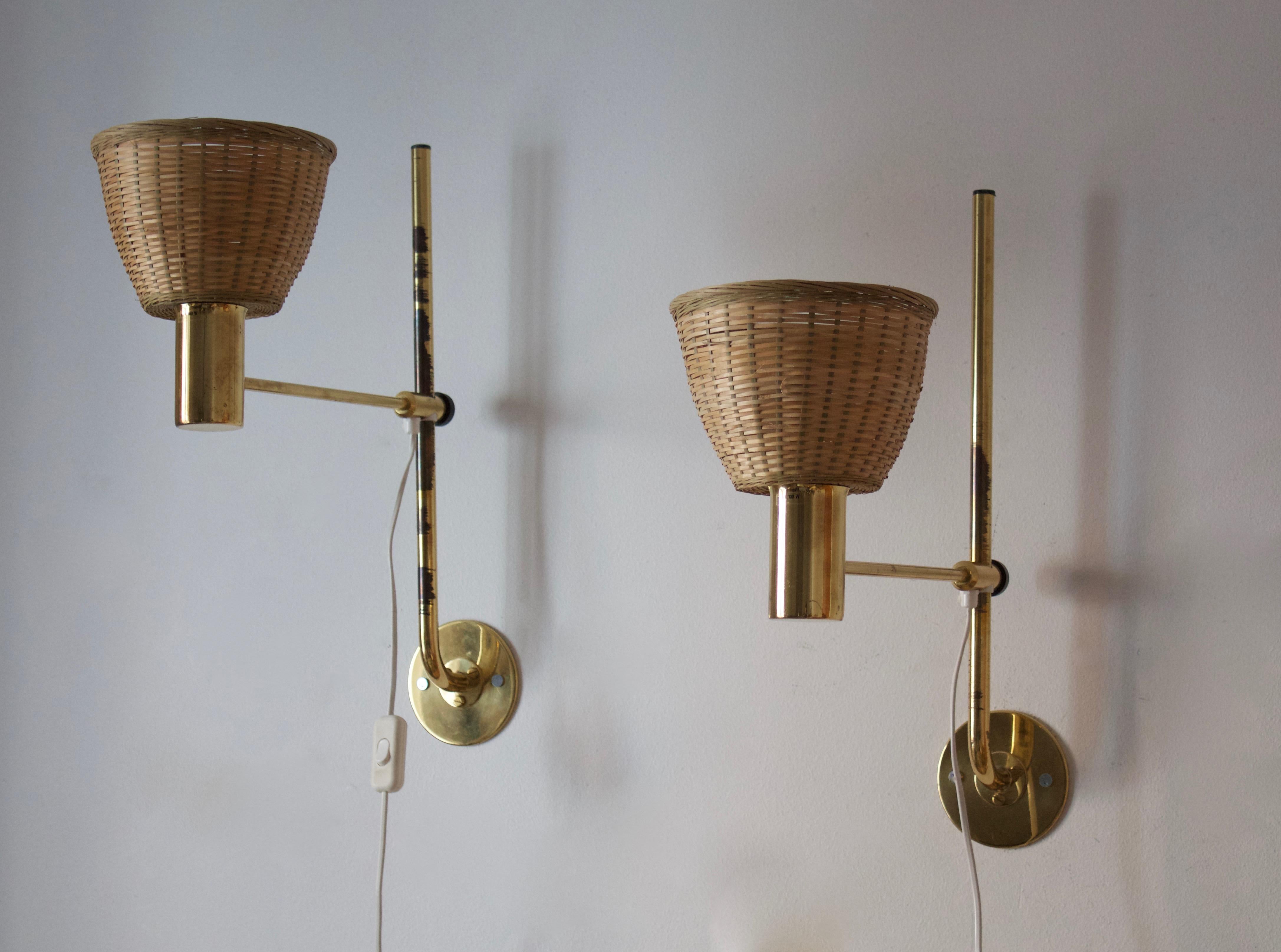 A pair of adjustable wall lights, designed by Hans-Agne Jakobsson for his own firm in Markaryd, Sweden. c. 1960s-1970s.

Assorted vintage rattan lampshades.