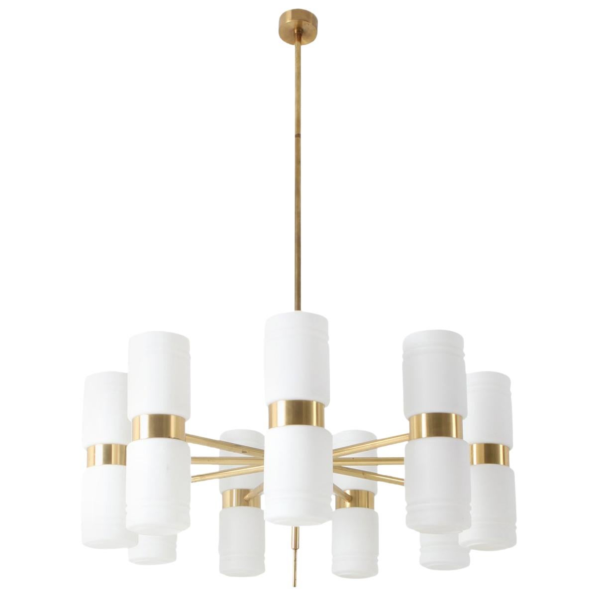 Midcentury Scandinavian Modern chandelier by Hans-Agne Jakobsson in brass and milky white opaline glass shades.

Huge and impressive piece with a diameter of 130 cm
The total height of the fixture is 200 cm. We can adjust this on request.


 