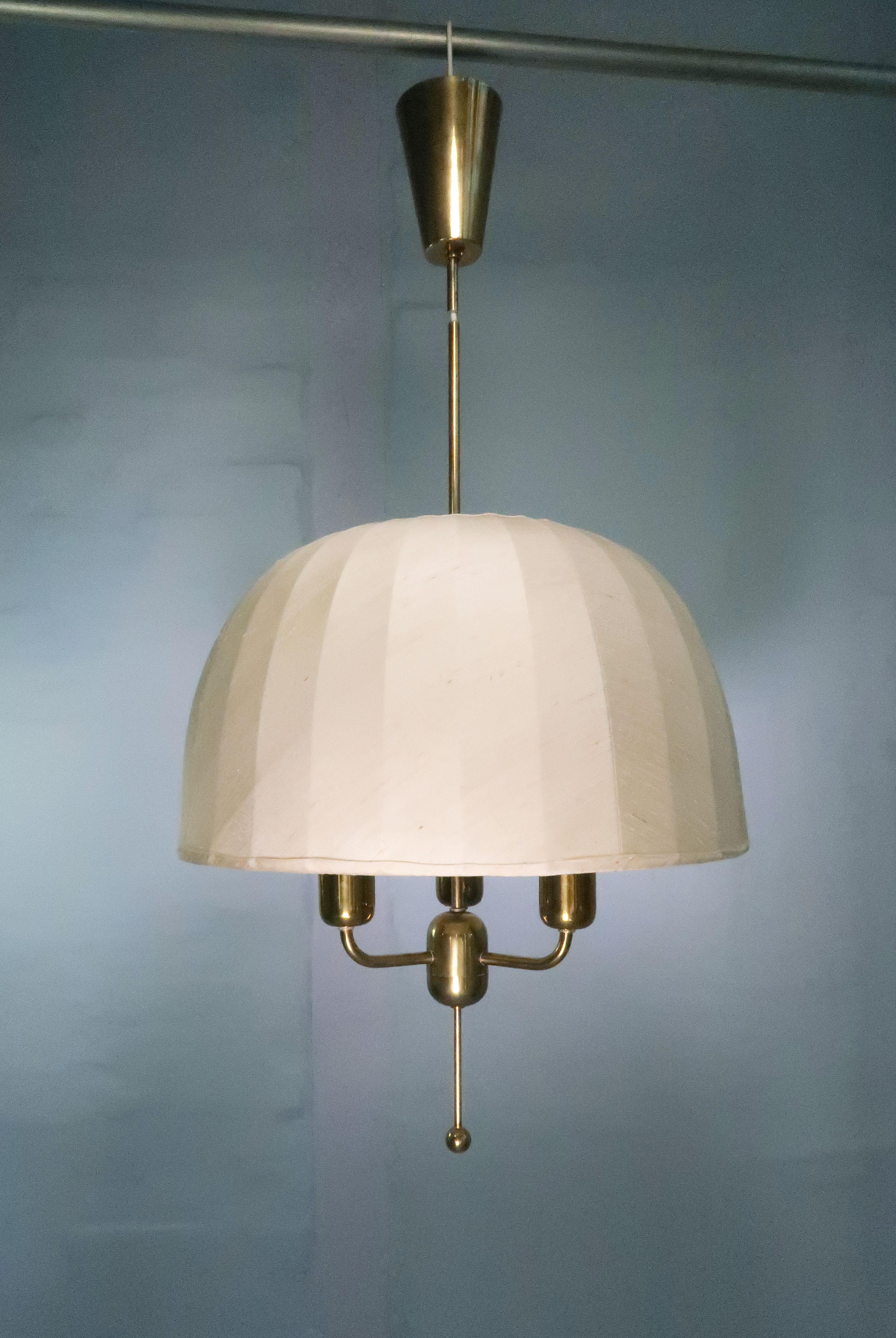 Large ceiling pendant designed by Hans Agne Jakobsson for AB Markaryd in 1963. Original cream/ivory white silk shade on white lacquered metal and brass mount. Original brass canopy and stem - height adjustable. Three bulbs. Label on