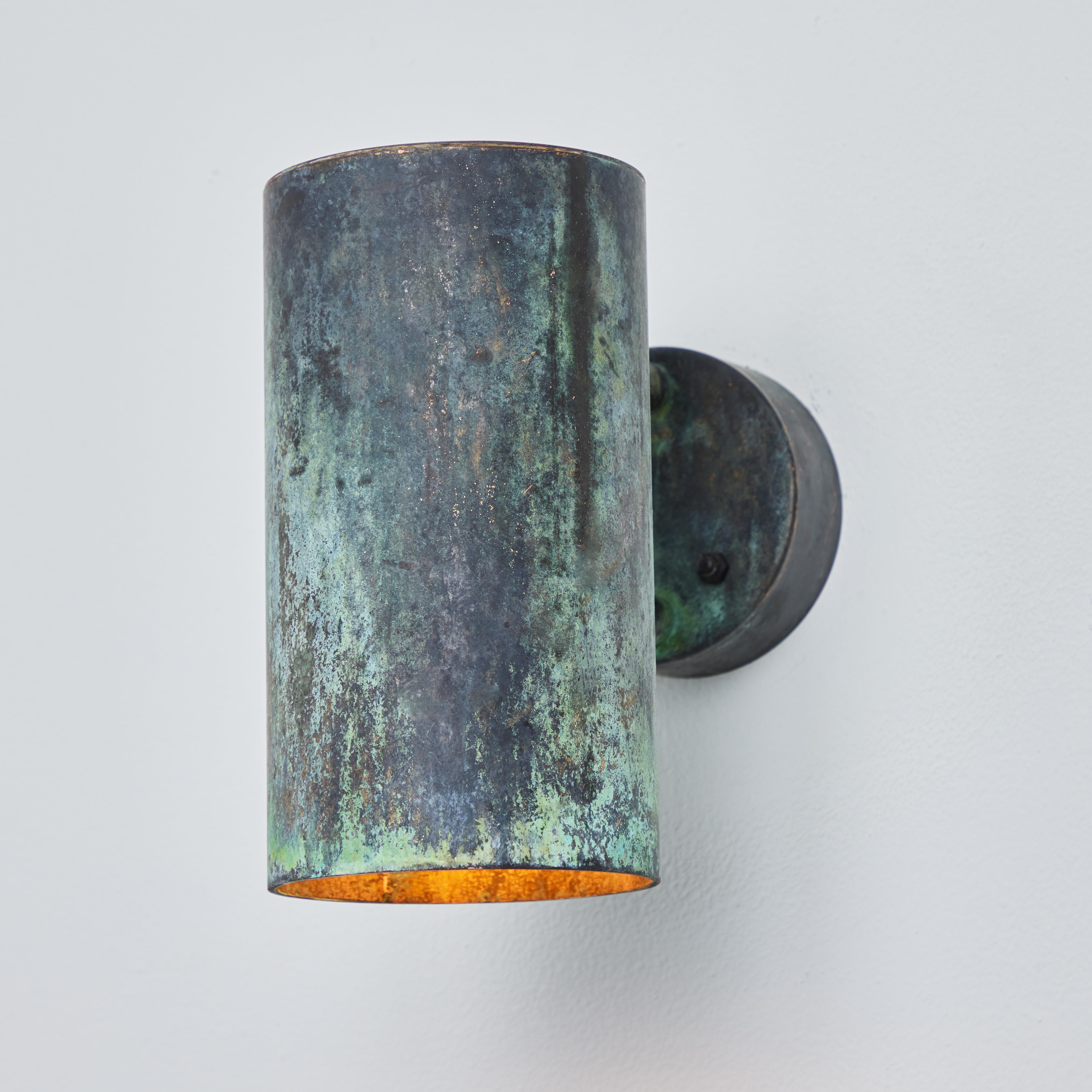 Hans-Agne Jakobsson C 627/110 'Rulle' darkly patinated outdoor sconce. An exclusive made for U.S. and UL listed authorized re-edition of the classic Swedish design executed in darkly patinated metal with raw unlacquered metal interior. An incredibly