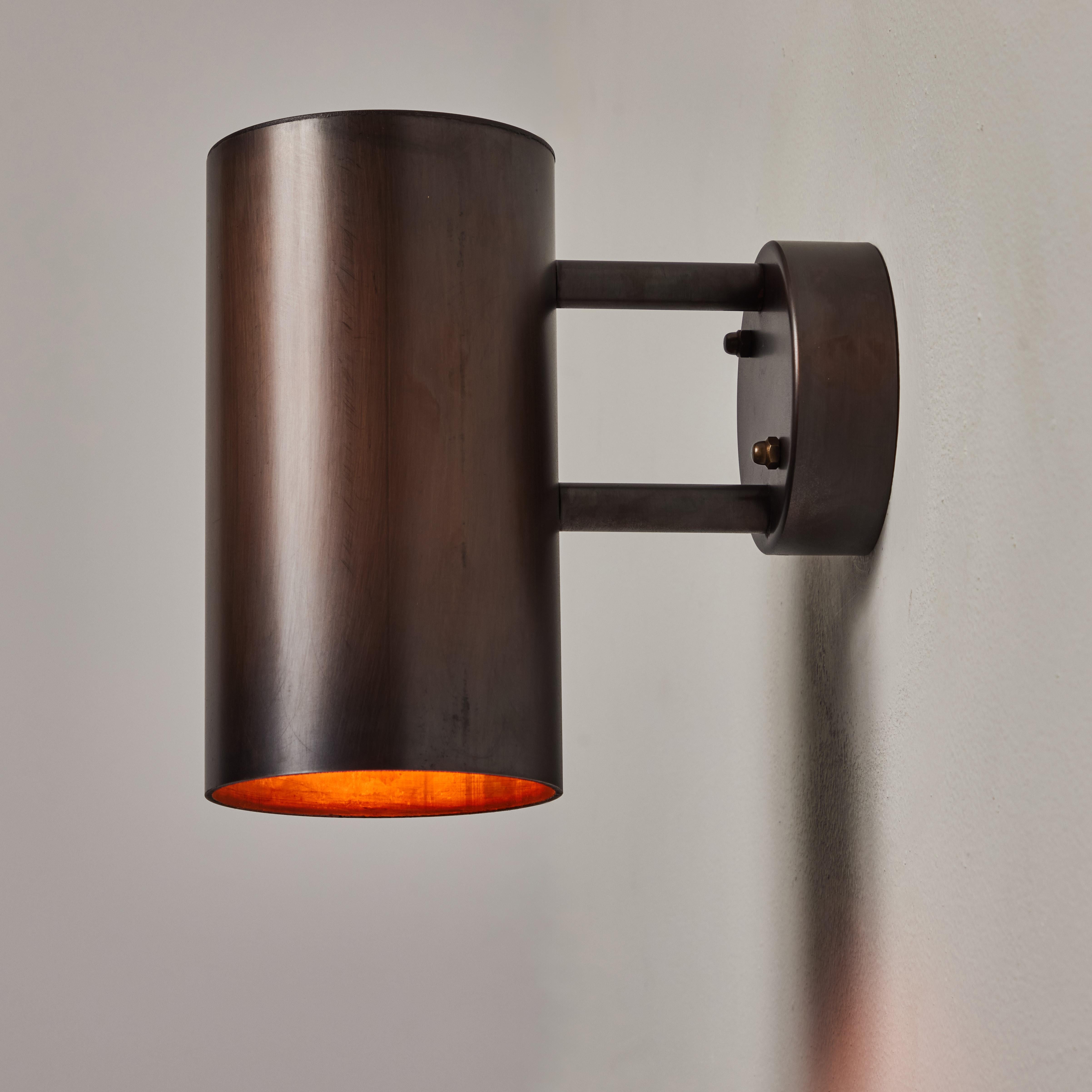 Hans-Agne Jakobsson C627/110 'Rulle' brown patinated outdoor sconce. An exclusive made for U.S. and UL listed authorized re-edition of the classic Swedish design executed in richly patinated metal that will continue to develop a lovely patina over
