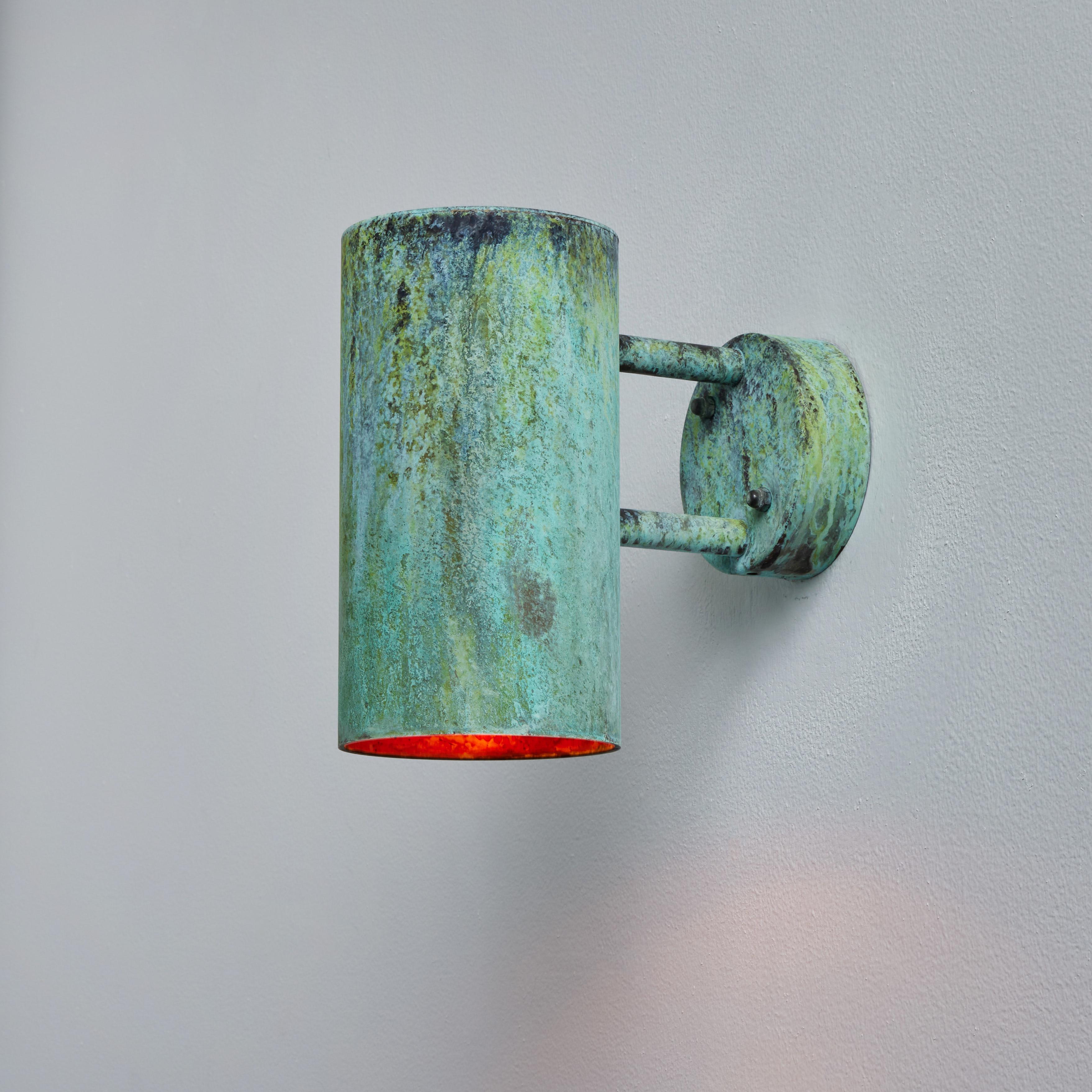 Hans-Agne Jakobsson C627/110 'Rulle' verdigris patinated outdoor sconce. An exclusive made for U.S. and UL listed authorized re-edition of the classic Swedish design executed in richly patinated metal that will continue to develop a lovely patina
