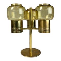 Hans Agne Jakobsson: Hurricane-Kerzenständer aus Messing und Glas, Schweden 1960