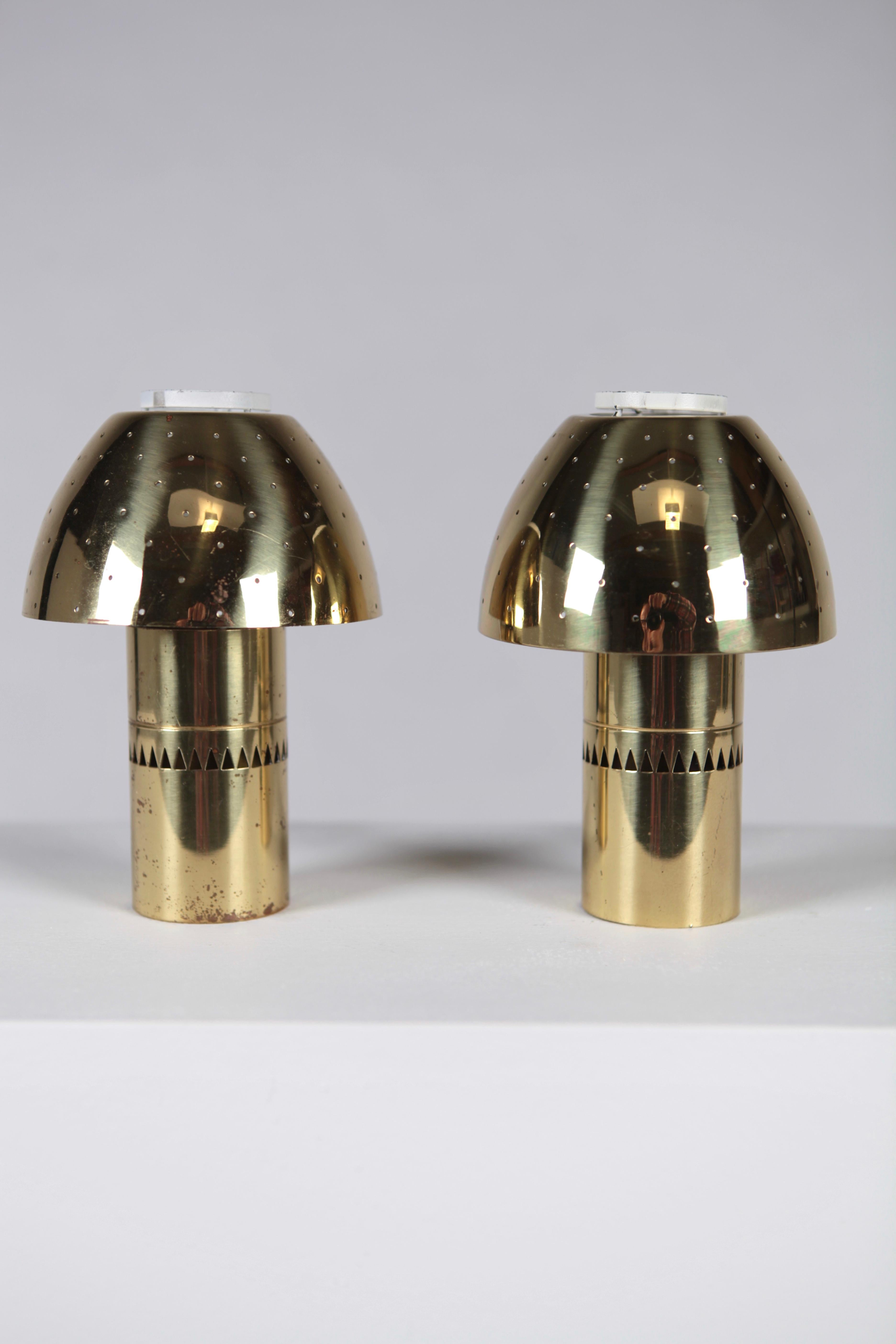 Pair of candle lights, model 145 designed by Hans-Agne Jakobsson.
Produced by Hans-Agne Jakobsson AB in Markaryd, Sweden in the 1960s.
One shade with some cracks, but no functional problem.
 