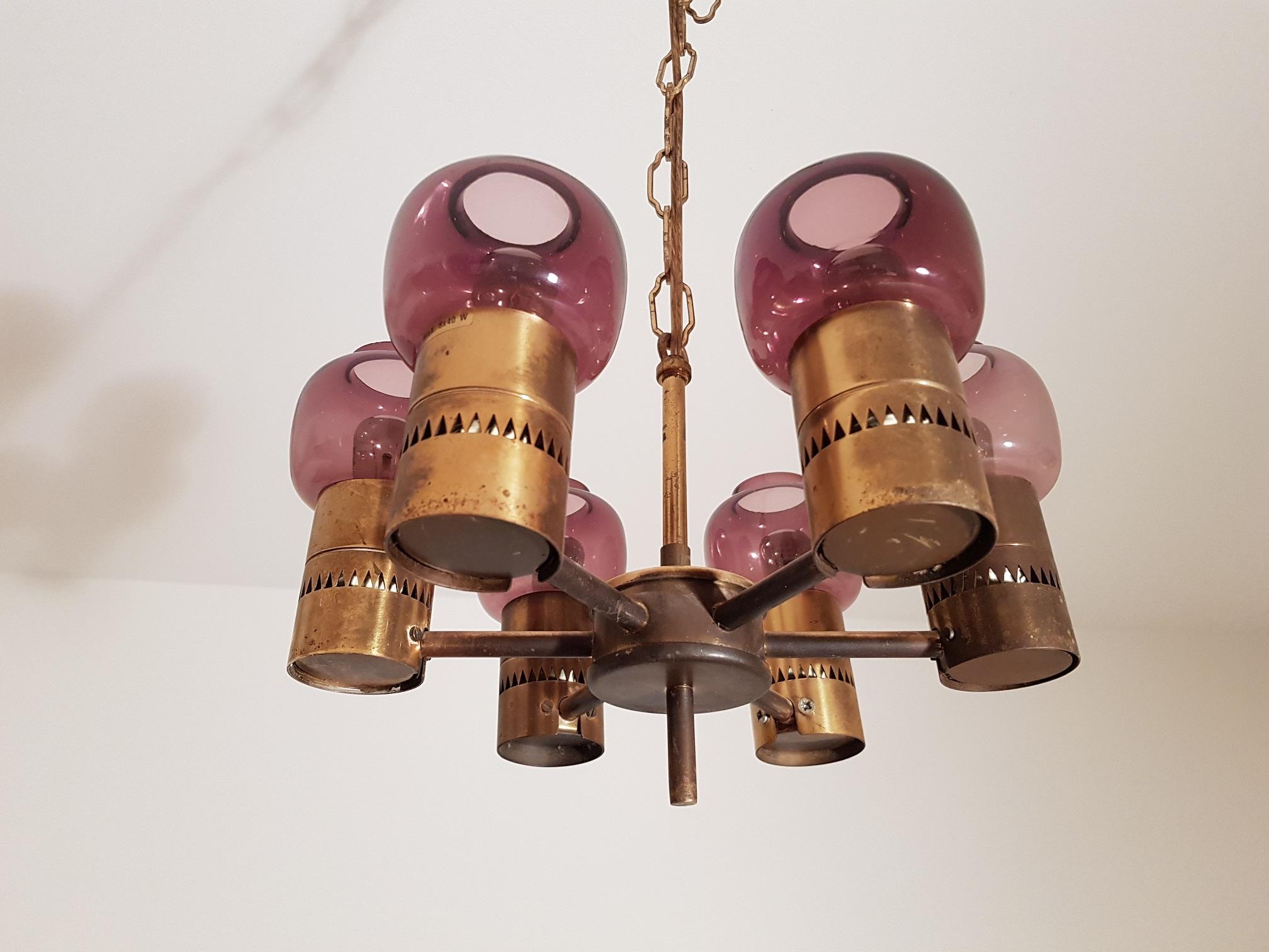 1 beautiful vintage ceiling lamp in brass and purple glass. Produced in the 1950s by Hans-Agne Jakobsson AB in Markaryd Sweden. A total of 6 light sources. Each glass case is 8 cm in diameter. Scandinavian modern design with the traditional brass