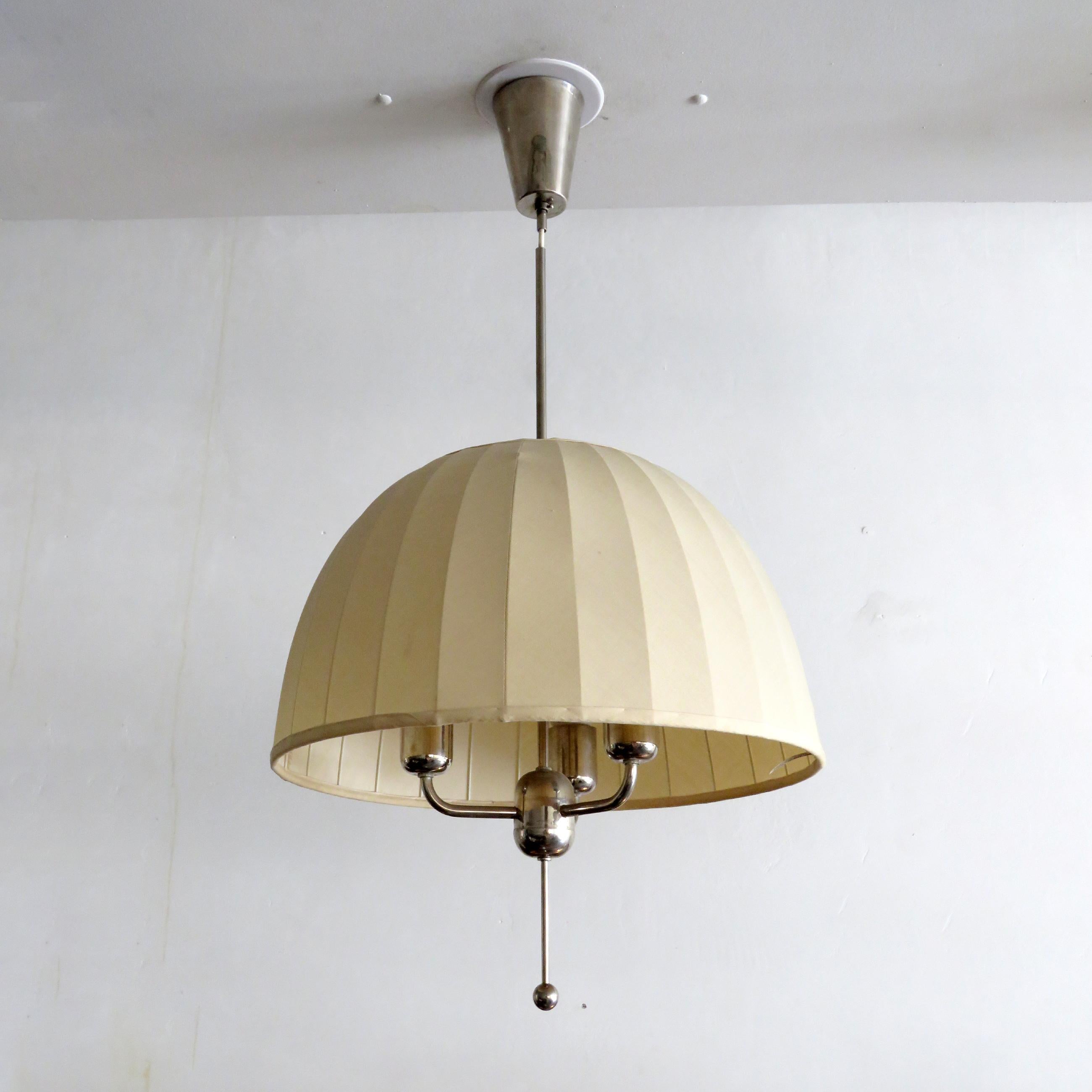 Wonderful pendant lamp 'Carolin' model T549/3 designed by Hans-Agne Jakobsson for Markaryd, Sweden, 1960, with nickel plated brass frame covered by a fabric shade, with original canopy. The overall drop as well as the vertical position of the shade