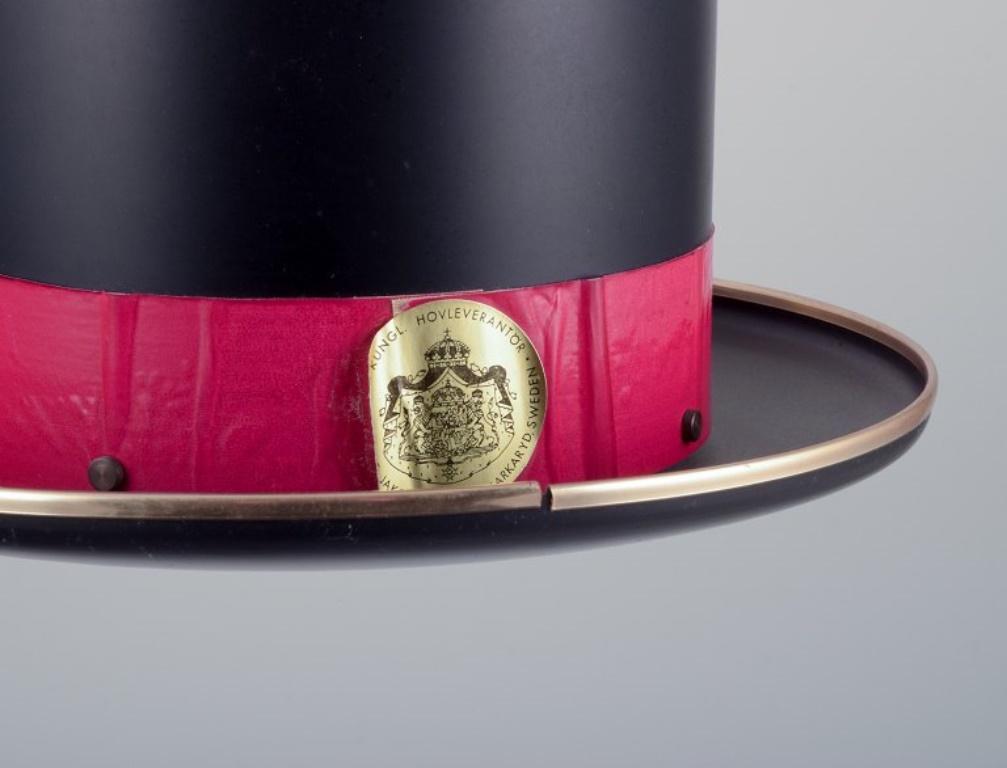 Late 20th Century Hans Agne Jakobsson. Ceiling lamp in the shape of a top hat in black metal. For Sale
