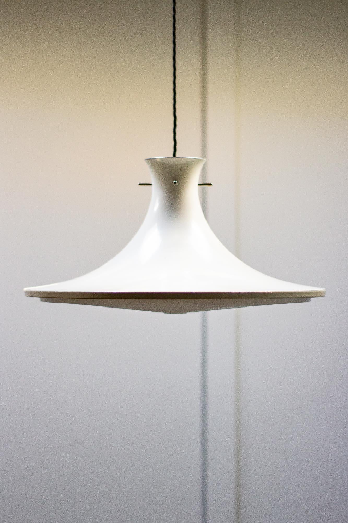 Ceiling light designed by Hans Agne Jakobsson for AB Markaryd.

This Swedish designer was well known for creating diffused muted lighting. Designed in the 1960s and has a metal shade and a plastic diffuser.

Theme is a small amount of paint loss