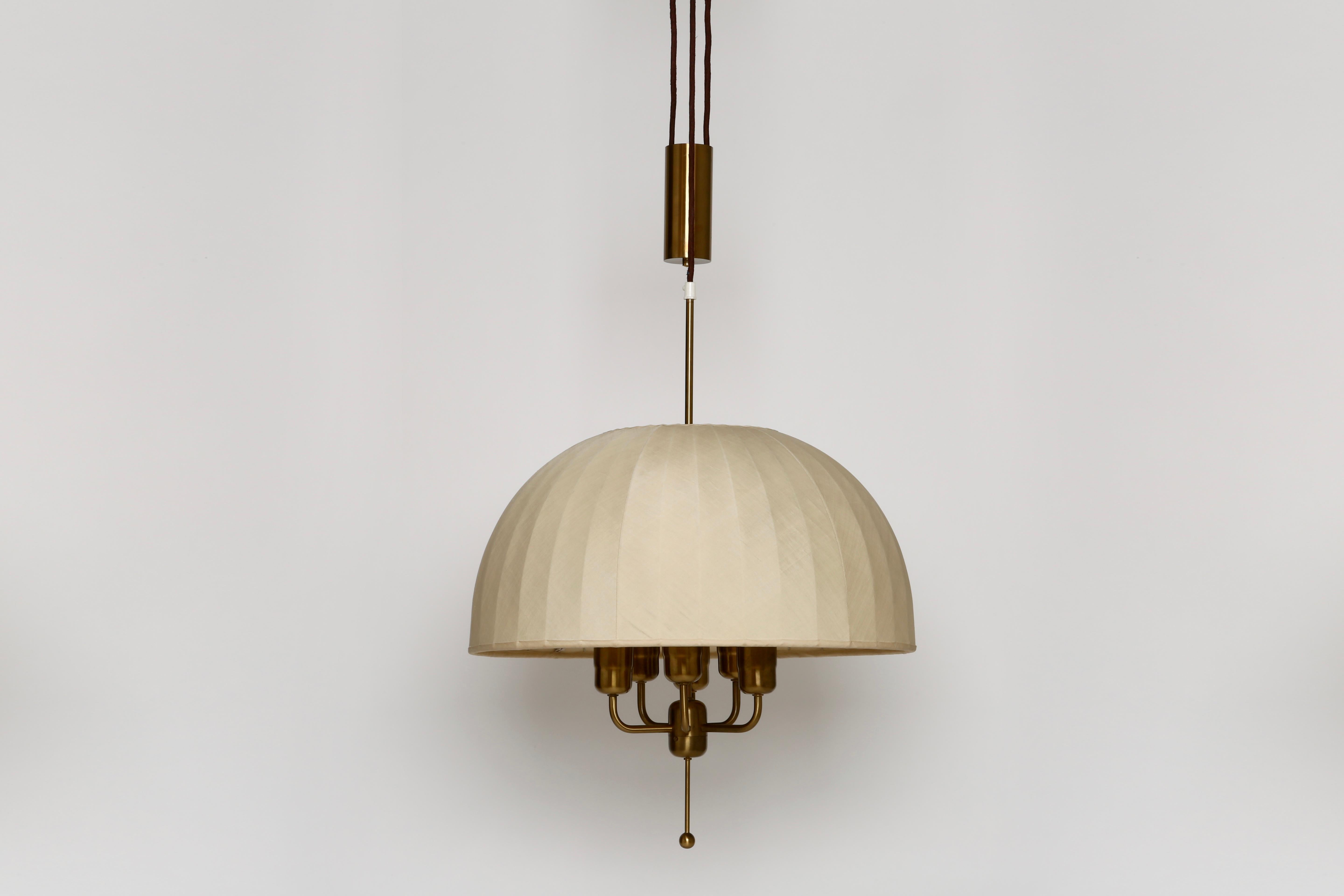 Hans-Agne Jakobsson counterbalance ceiling pendant.
Patinated brass. Large silk shade. Counterbalance weight.
Also available without counterbalance weight in a polished brass finish.
 