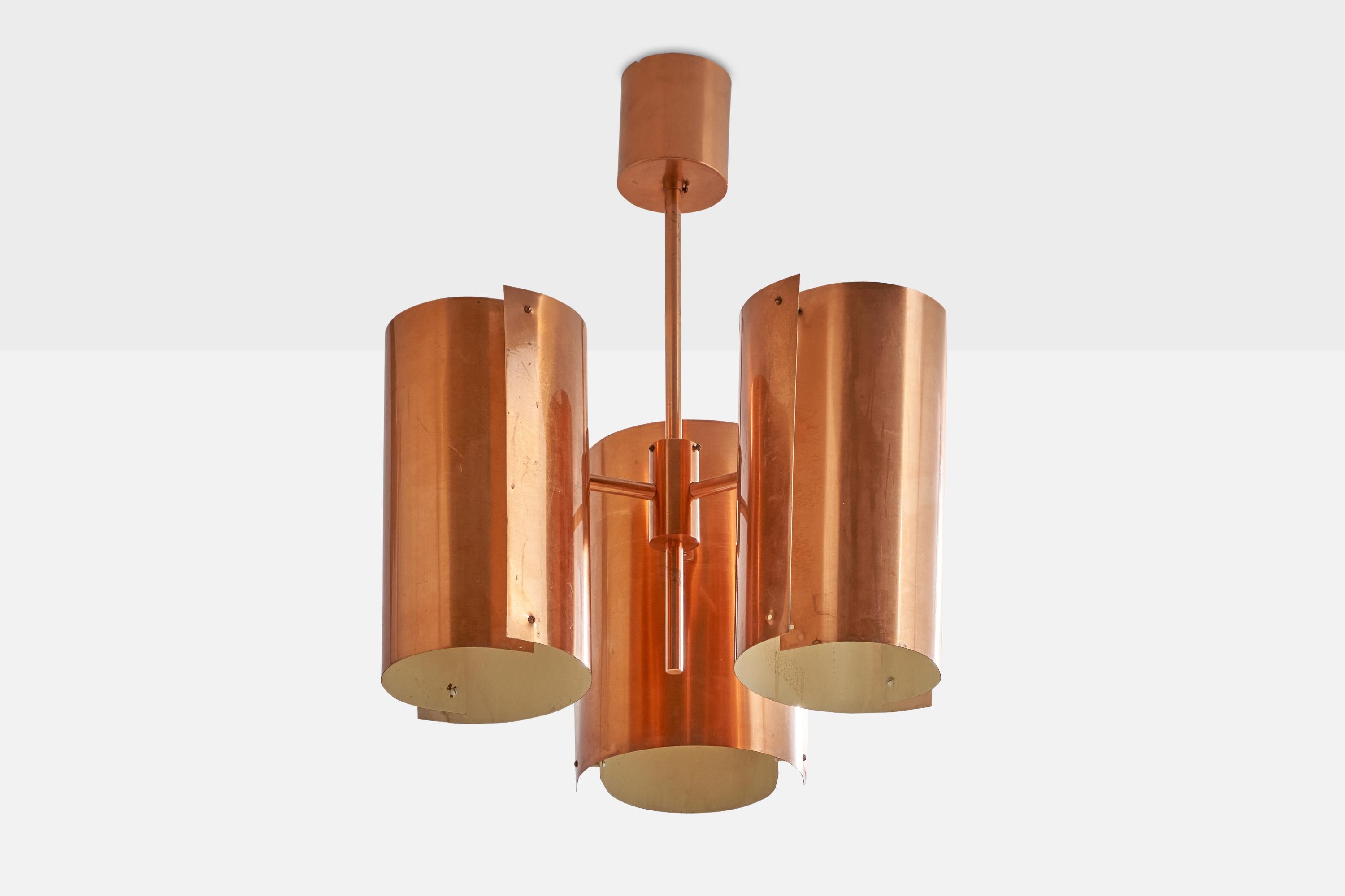 A three-armed copper chandelier designed and produced by Hans Agne Jakobsson, Sweden, 1960s.

Dimensions of canopy (inches): 4.75” H x 4.4” Diameter
Socket takes standard E-26 bulbs. 4 sockets.There is no maximum wattage stated on the fixture. All