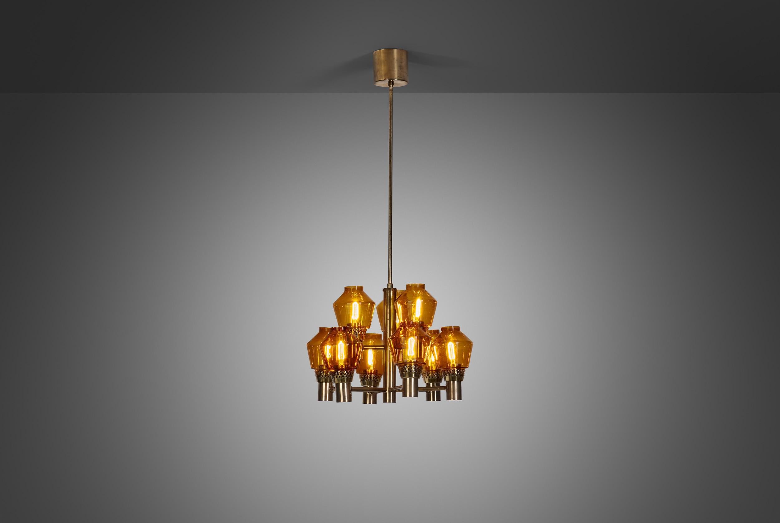 This equally rare and marvellous, brass nine-light chandelier was created in what we now call “the golden age of Scandinavian design”. Hans-Agne Jakobsson was the great Swedish master of lighting, designing some of the most recognizable mid-century