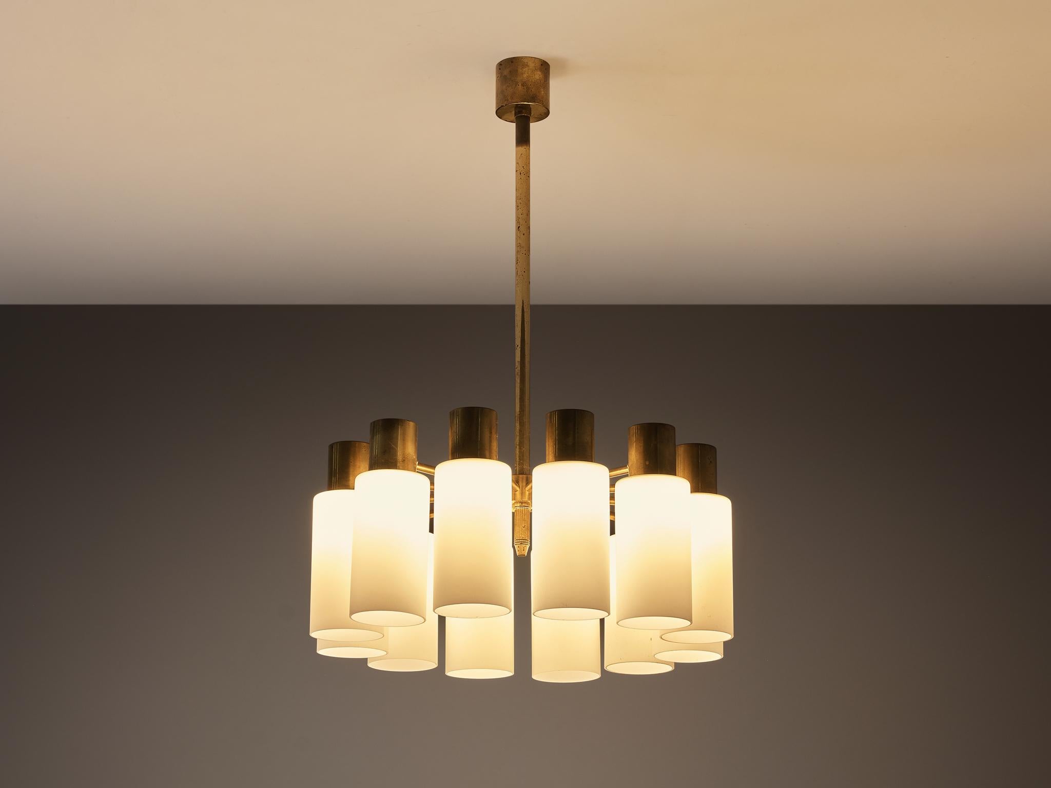 Hans-Agne Jakobsson for Hans-Agne Jakobsson AB in Markaryd, chandelier, brass, opaque glass, Sweden, 1960s

Designed by the illustrious Swedish master Hans-Agne Jakobsson, this impressive chandelier has a stunning and demanding presence. Executed