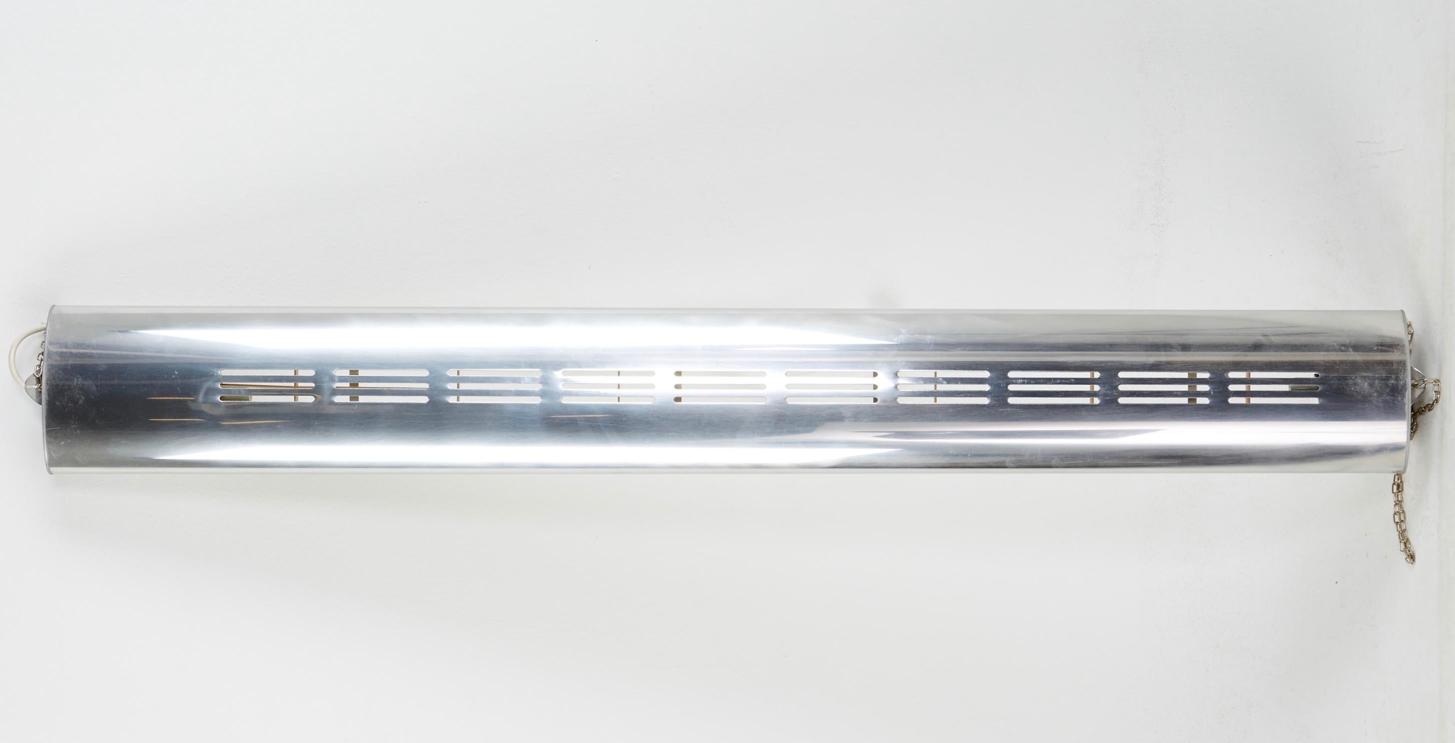 Ovalux ceiling lamp designed by Hans-Agne Jakobsson for Markaryd, produced in Sweden in 1970s. Made in stainless steel and chromed aluminum, two fluorescent lights. Marked and labeled by the manufacturer.